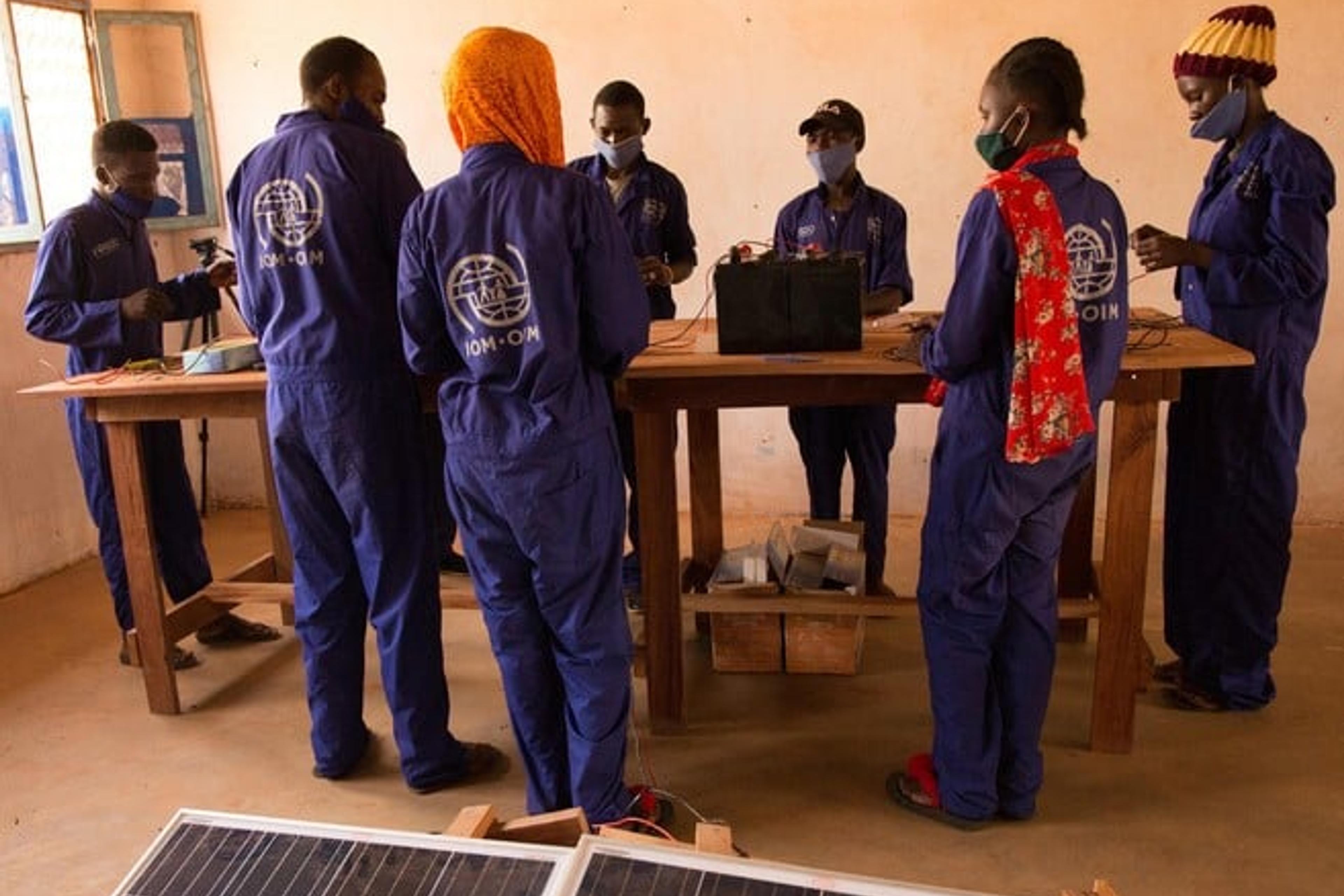 Youths learn how to repair solar panels