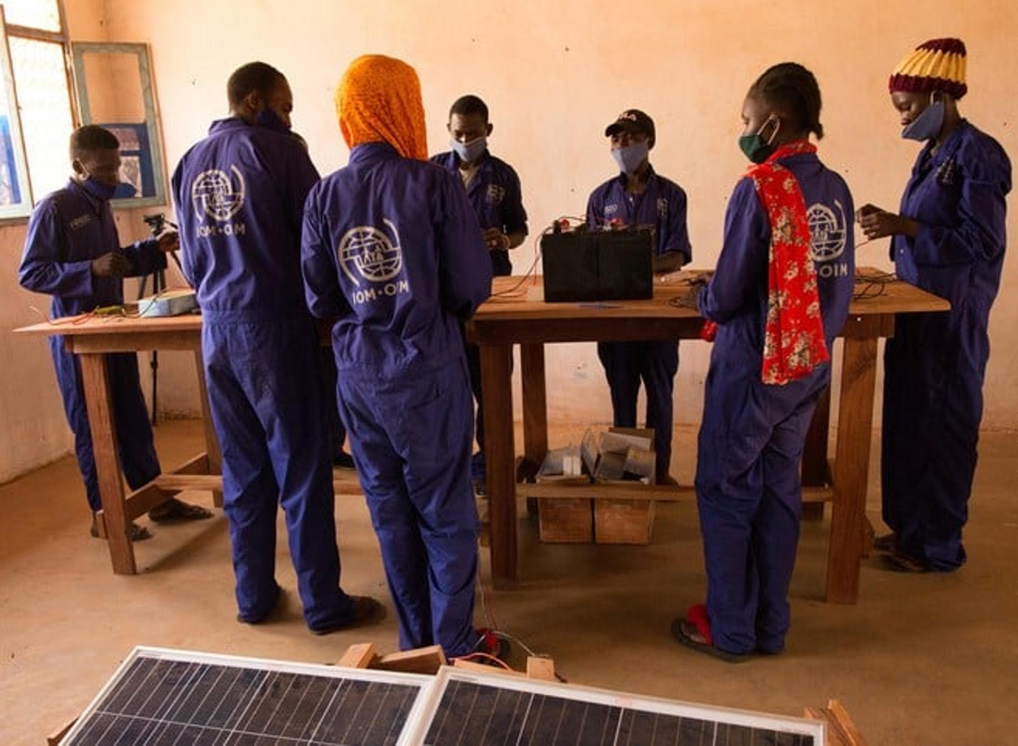 Youths learn how to repair solar panels