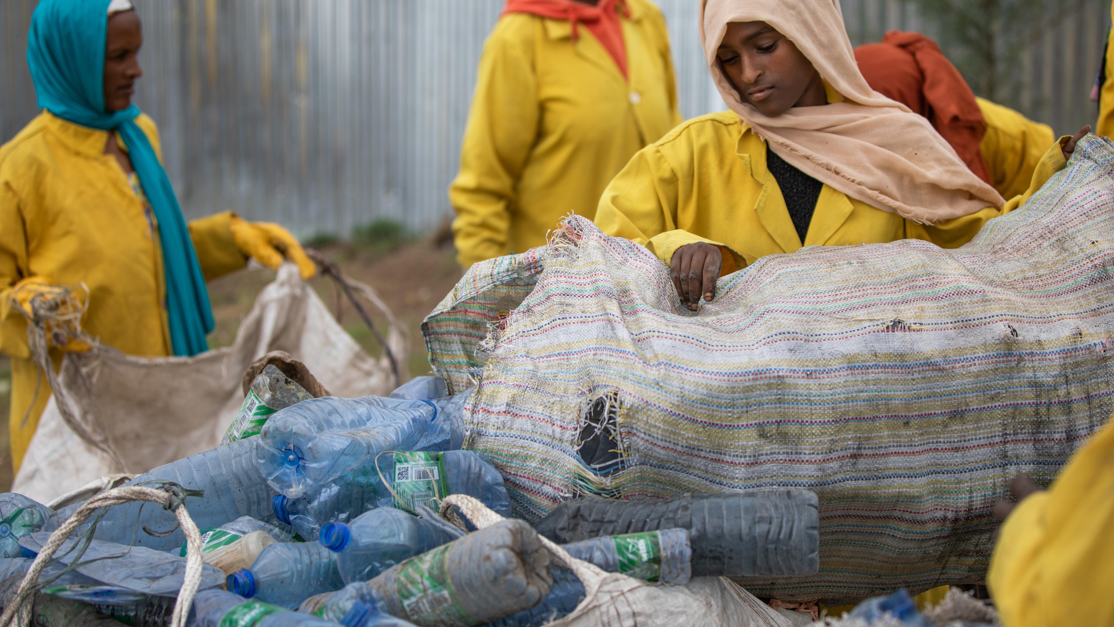 Women sorting plastic bottles