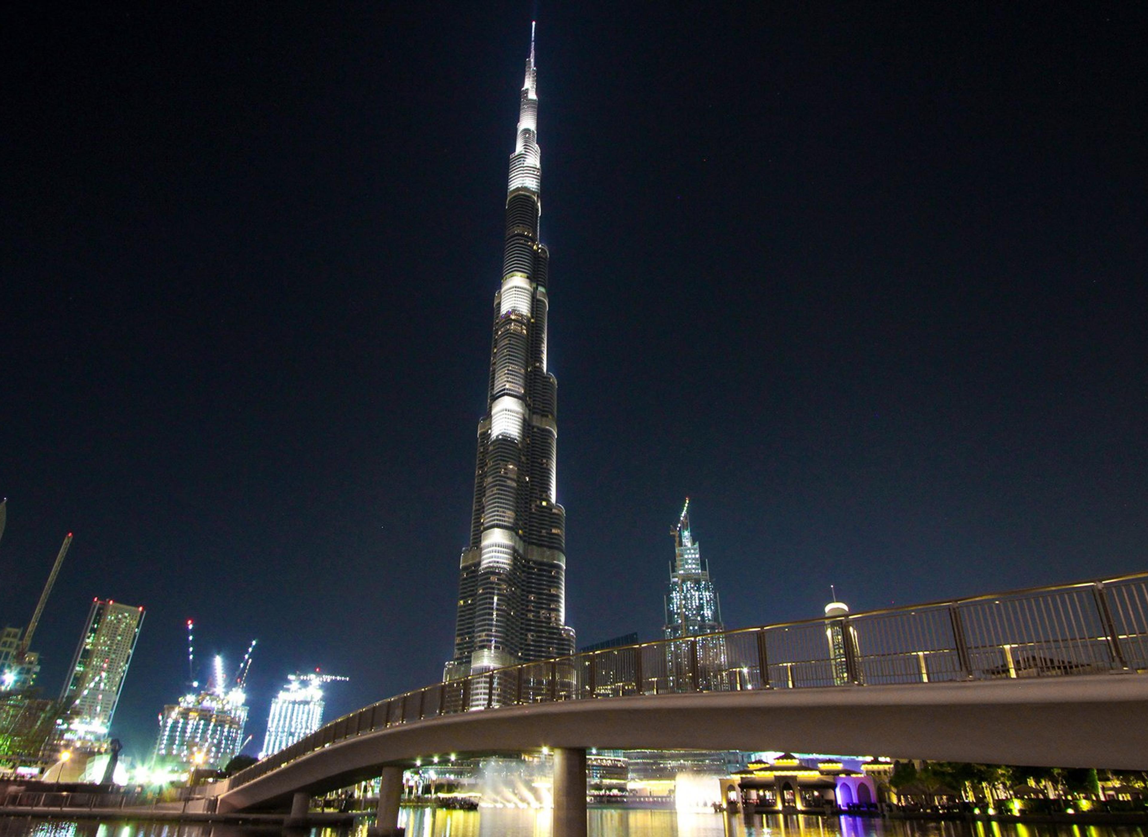 Dubai skyscraper tower in night ligst