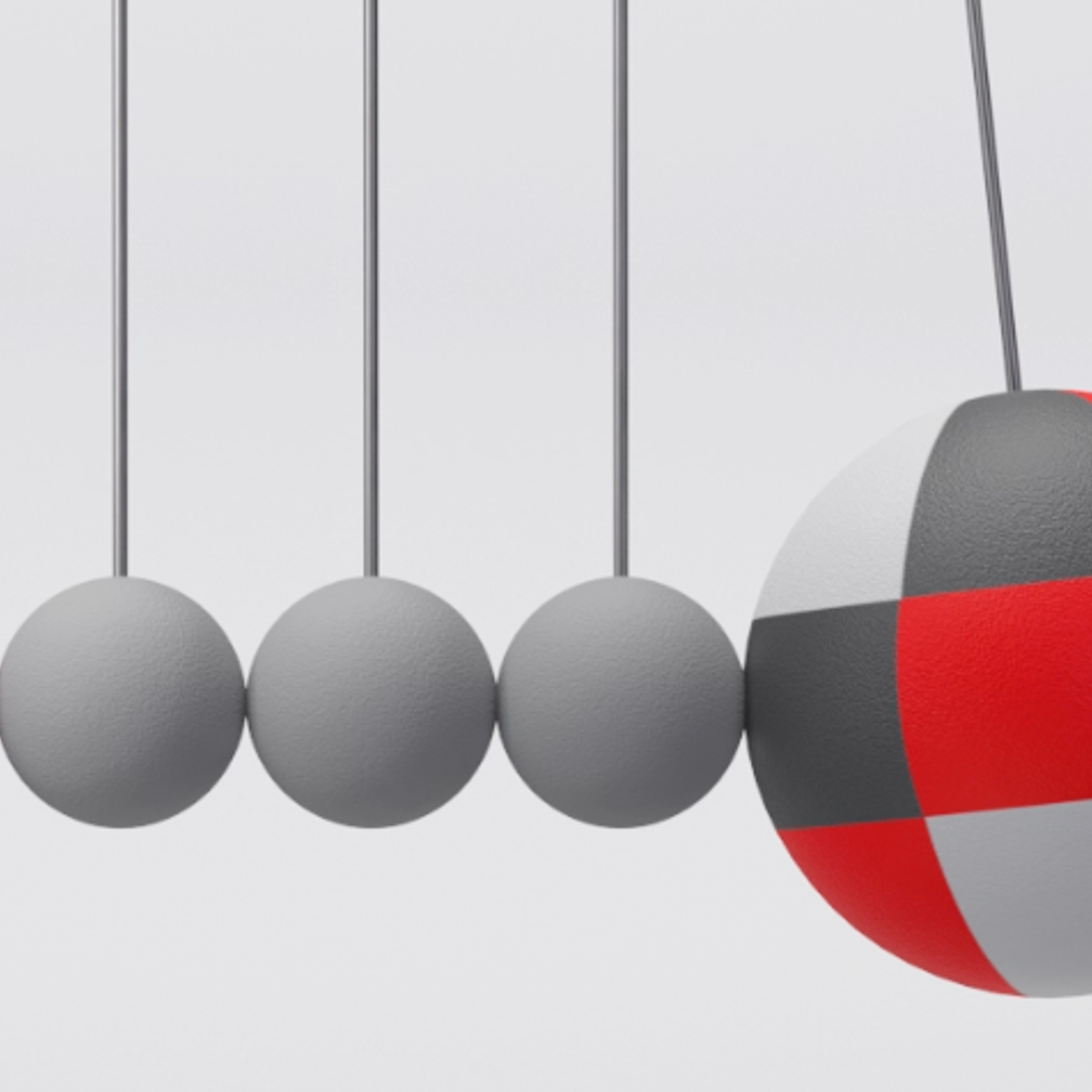 Fem kuler i rødt og grått henger ved siden av hverandre og den største slår inntil den ene for å illustrere bevegelse.