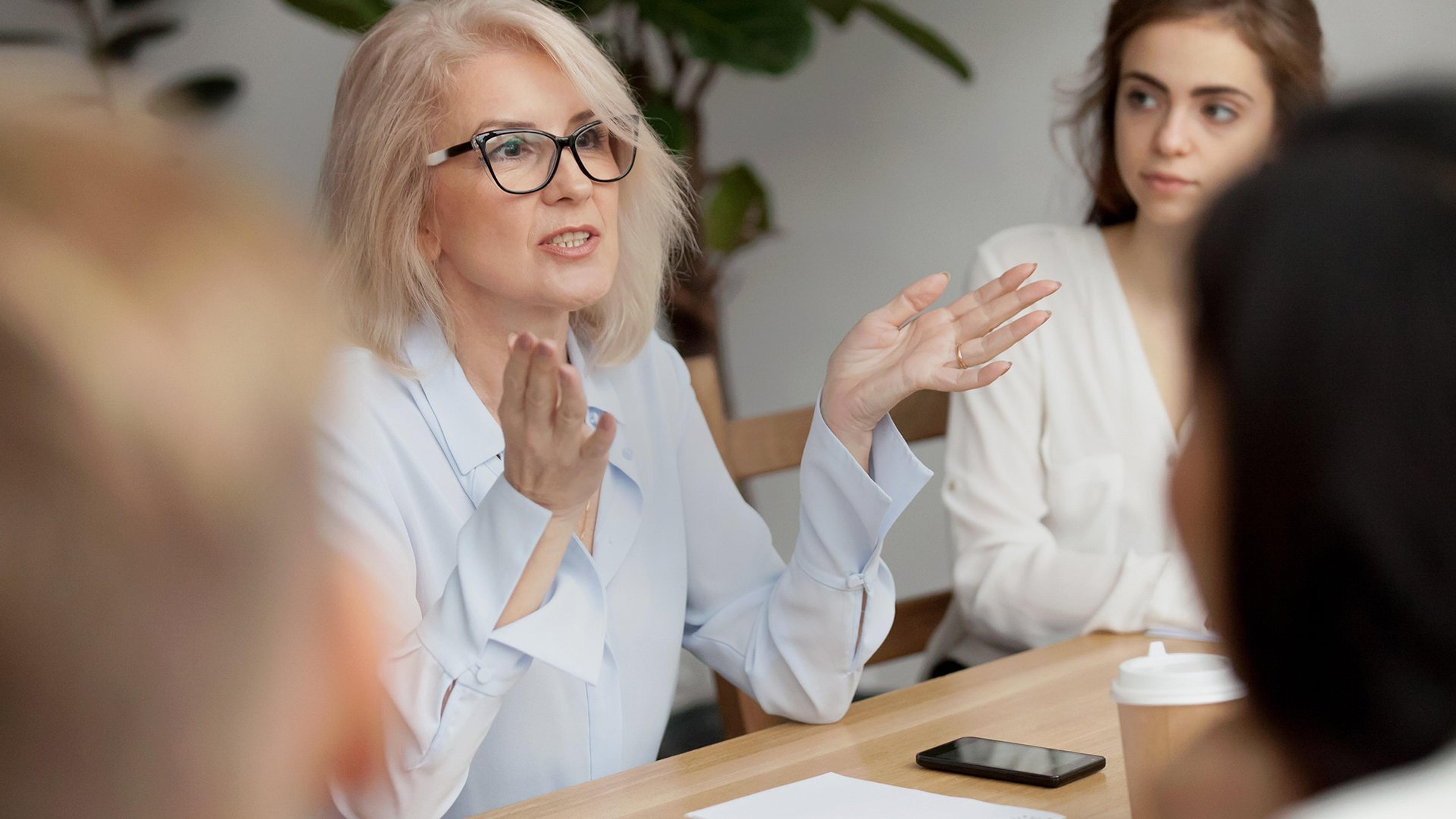 Woman explaining to people