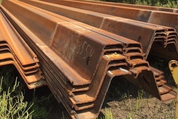 Used PZ-27 sheet pile stacked in the yard