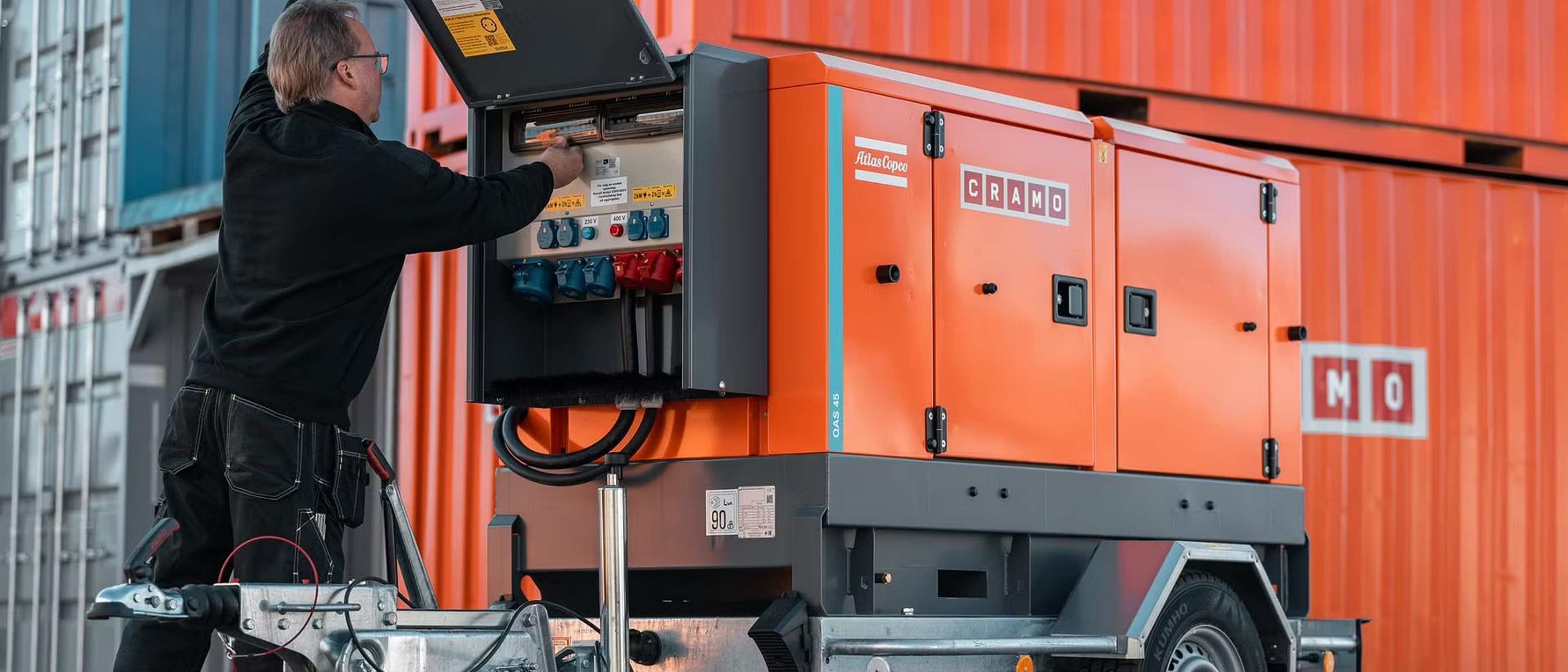 A man standing in front of a Cramo electric central