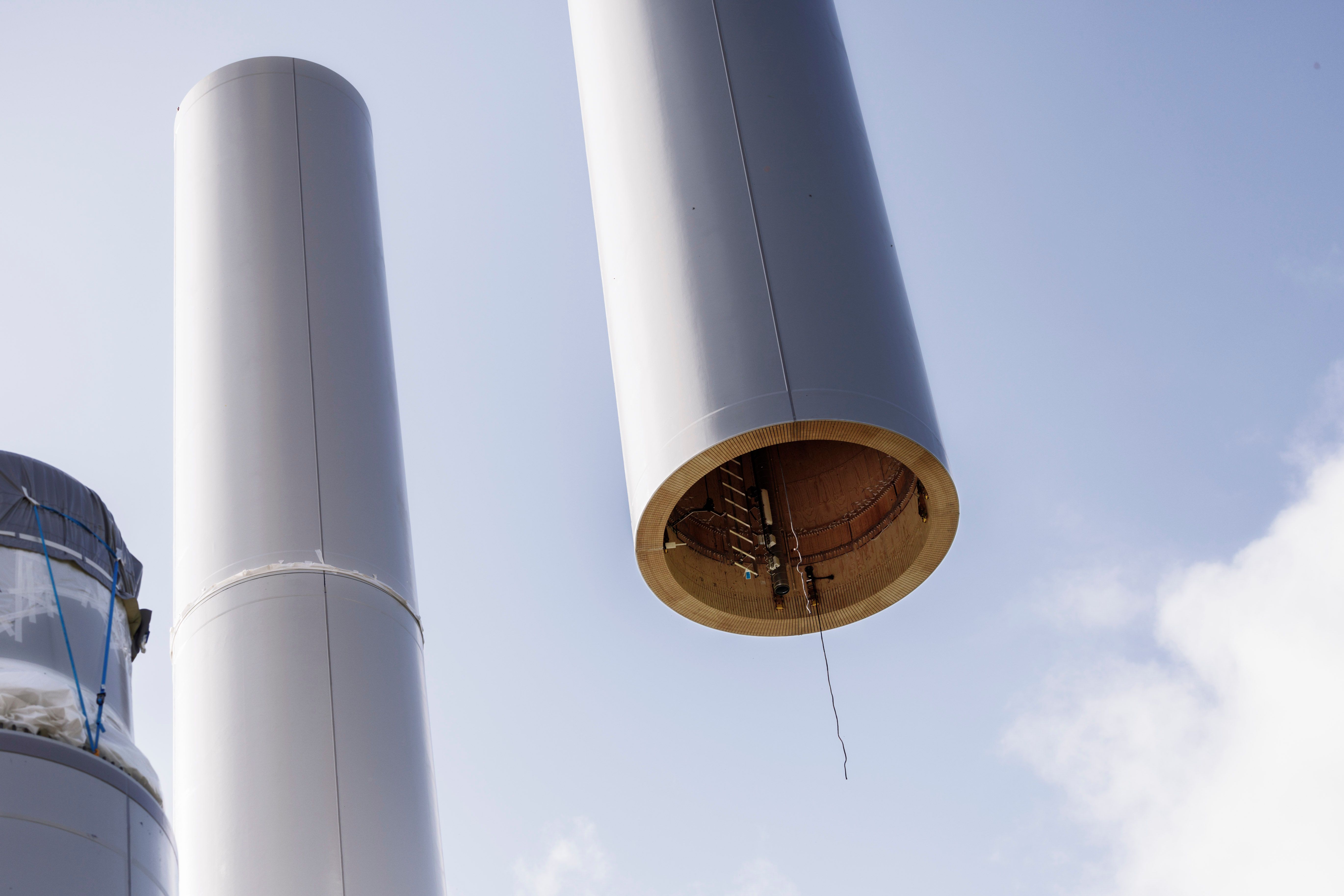 A wooden wind turbine under construction.