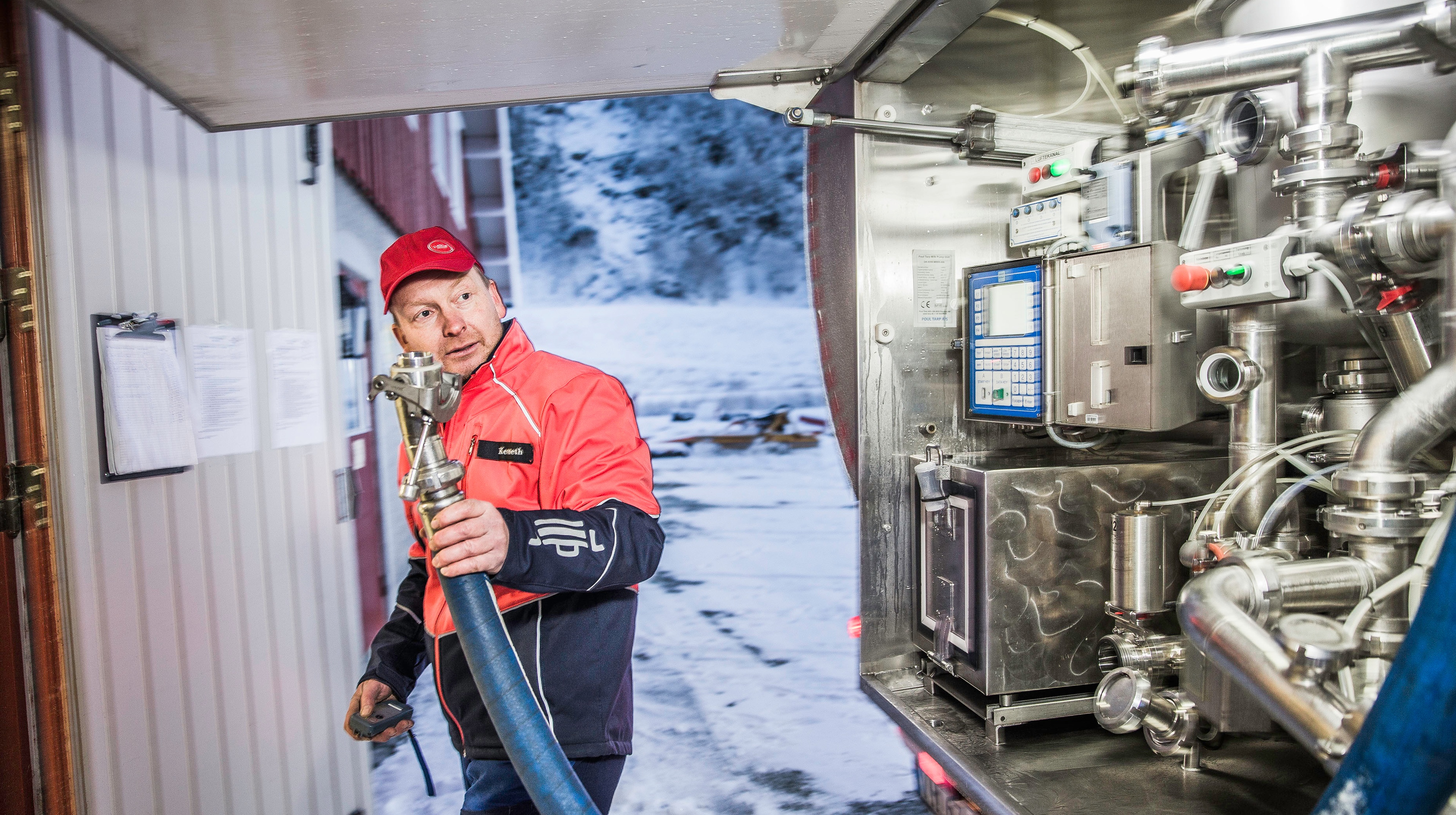 Man working with a milk machine.