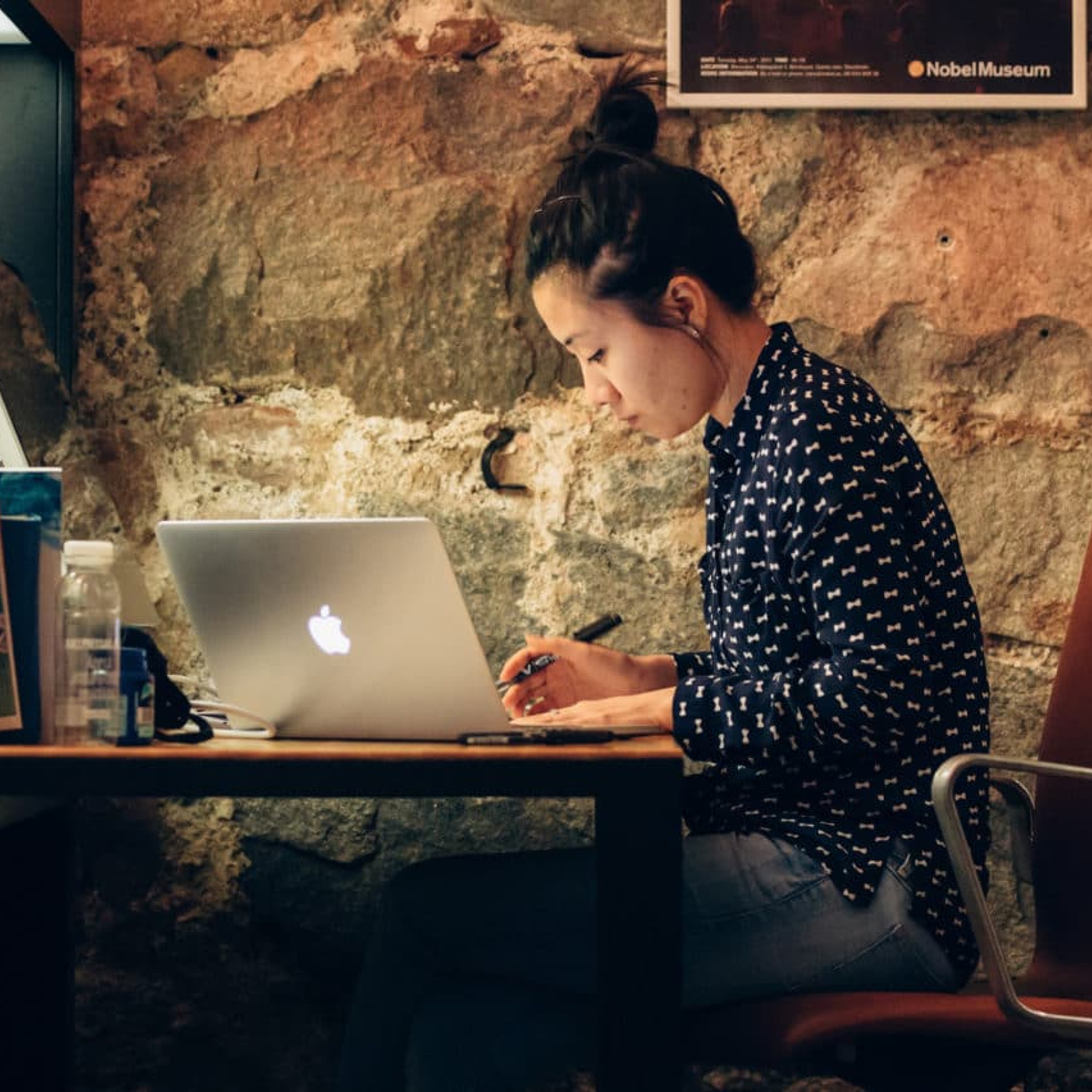 Image showing a woman sitting by a desk