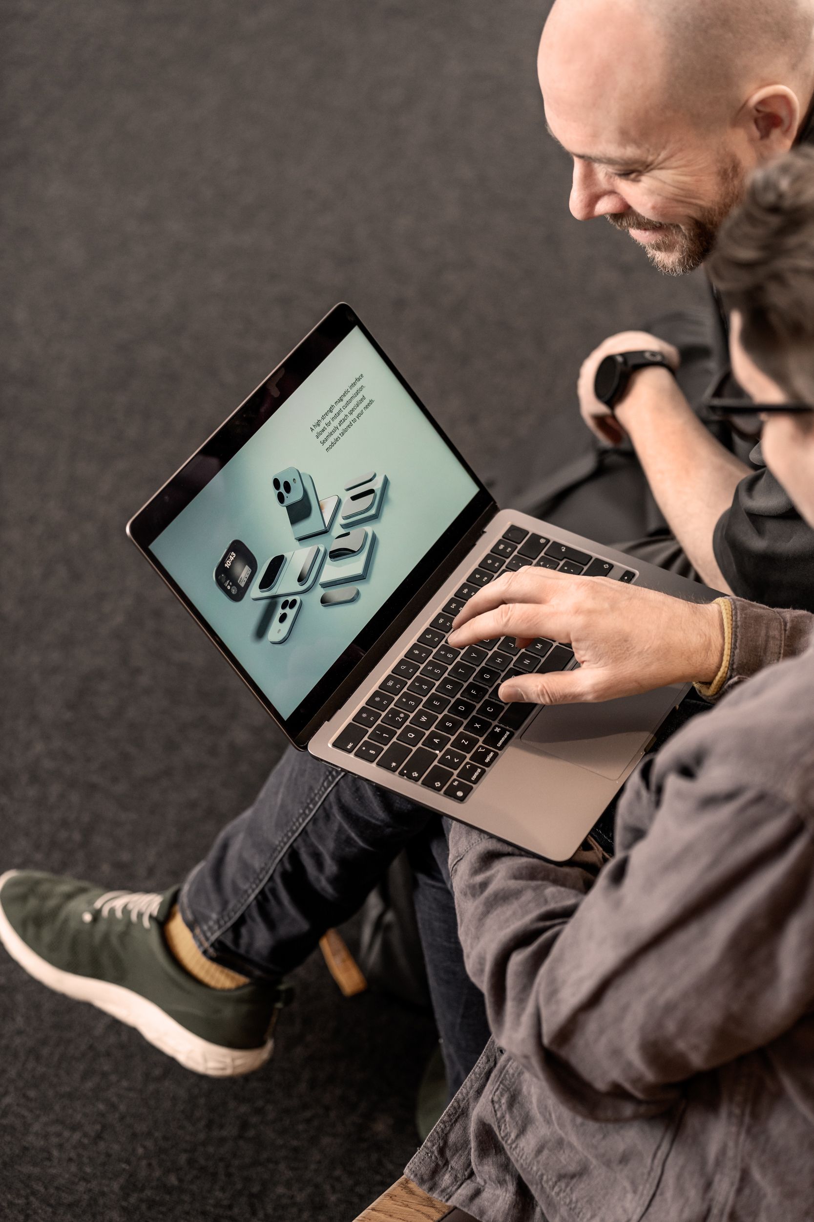 Person holding a phone with AI on the screen