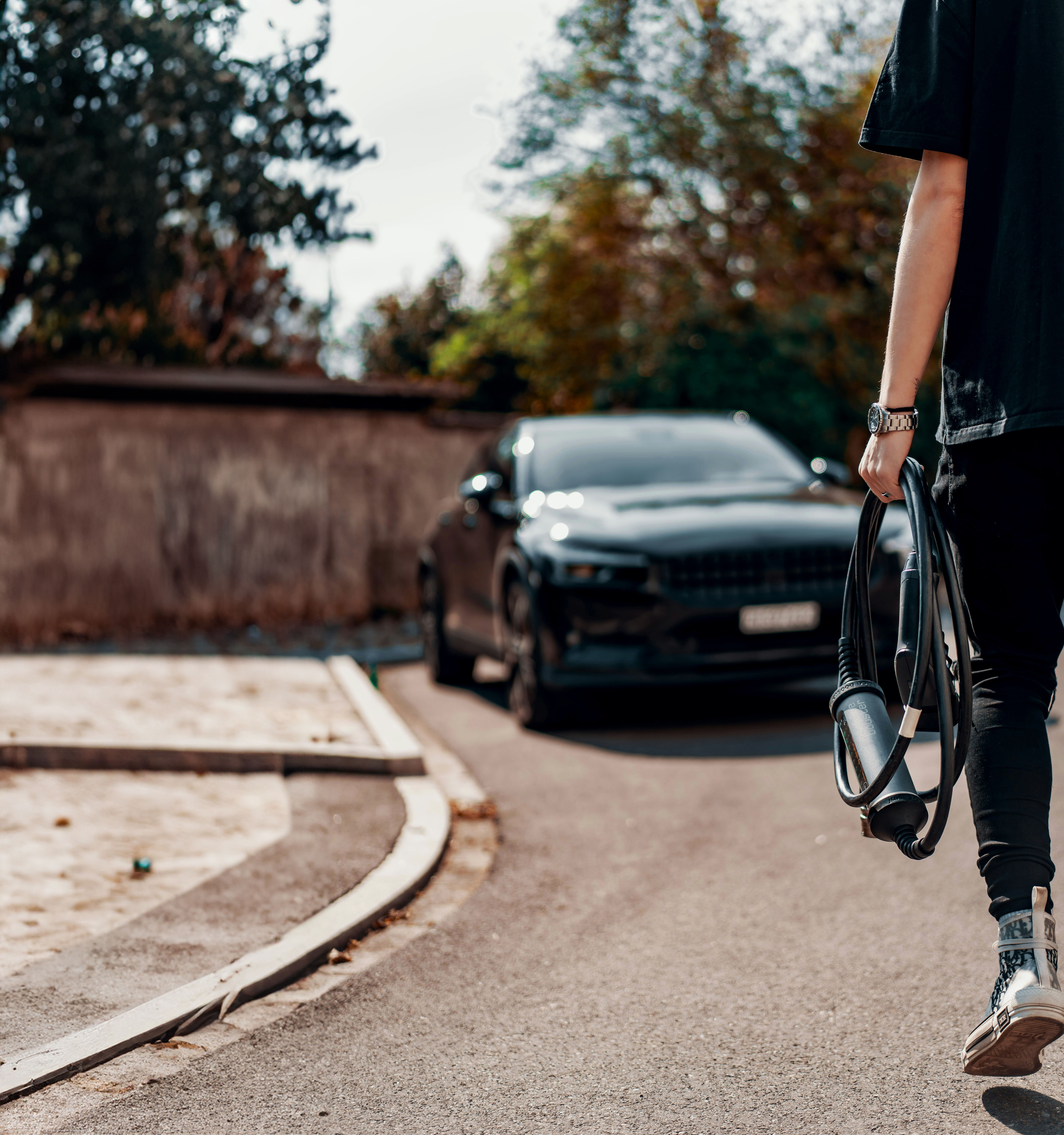 Tre people on a roof installing solar panels