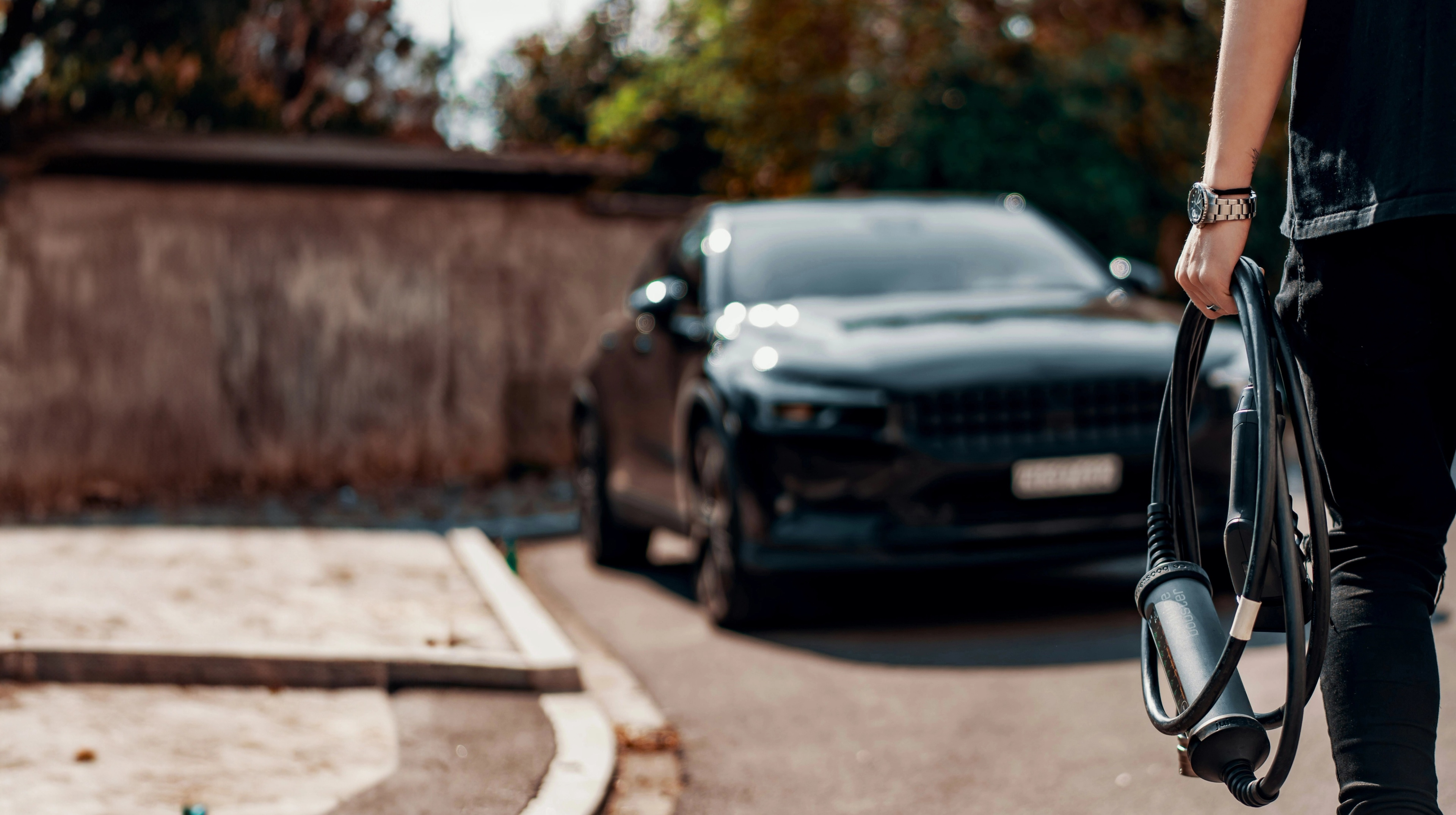 Tre people on a roof installing solar panels