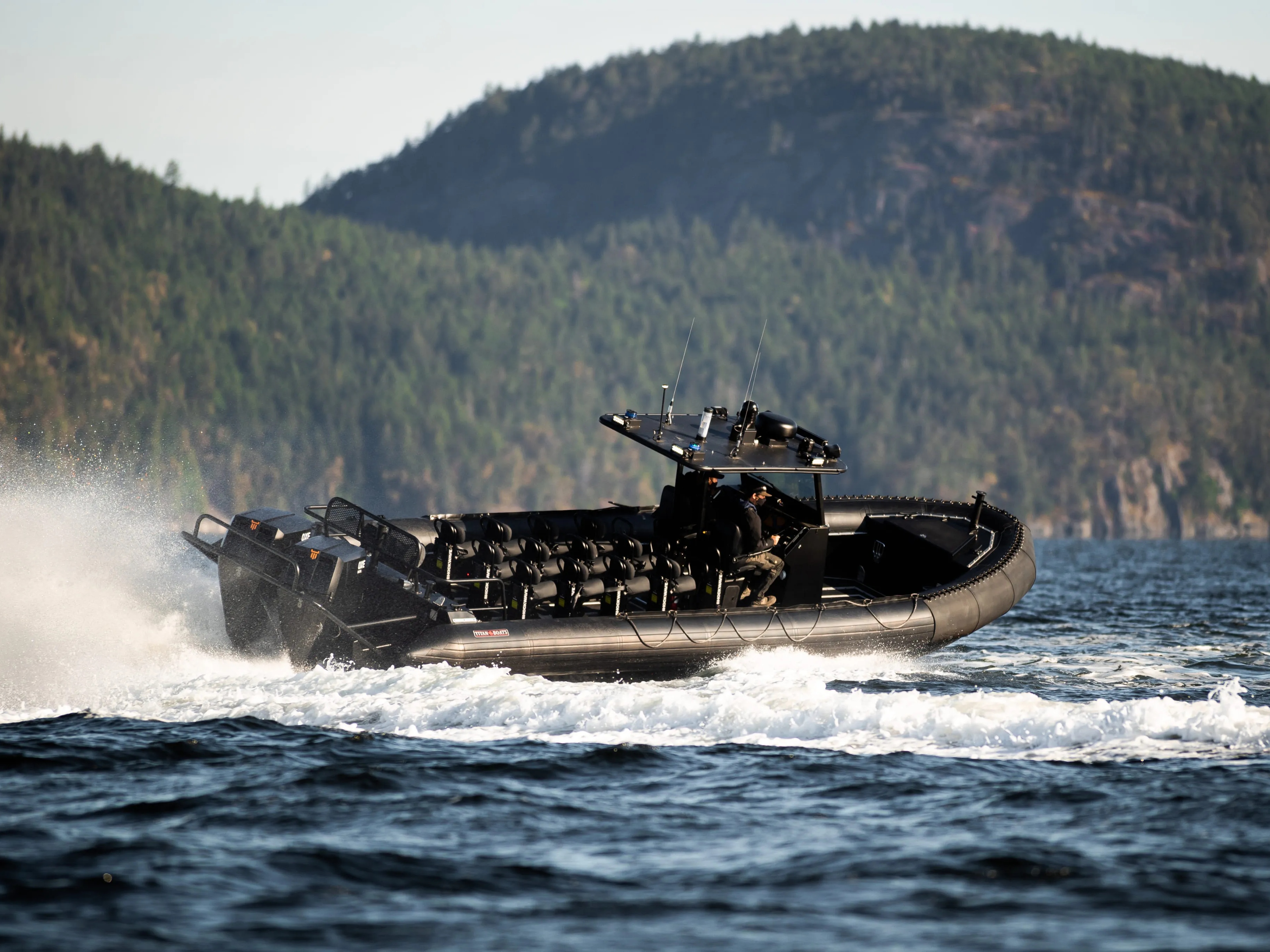 Image of a motorboat driving close to the shore