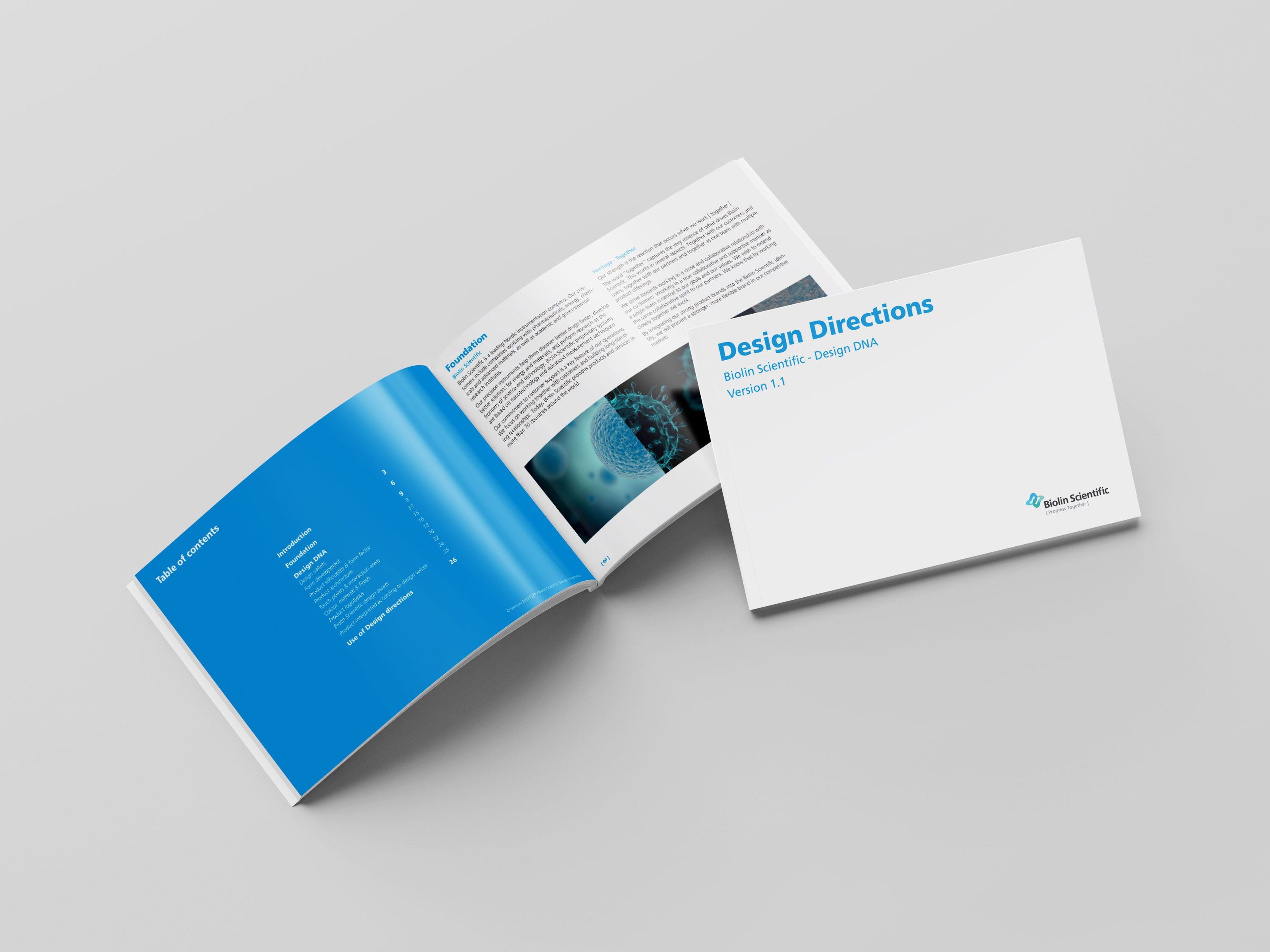 Open design strategy booklet with layout and branding content.