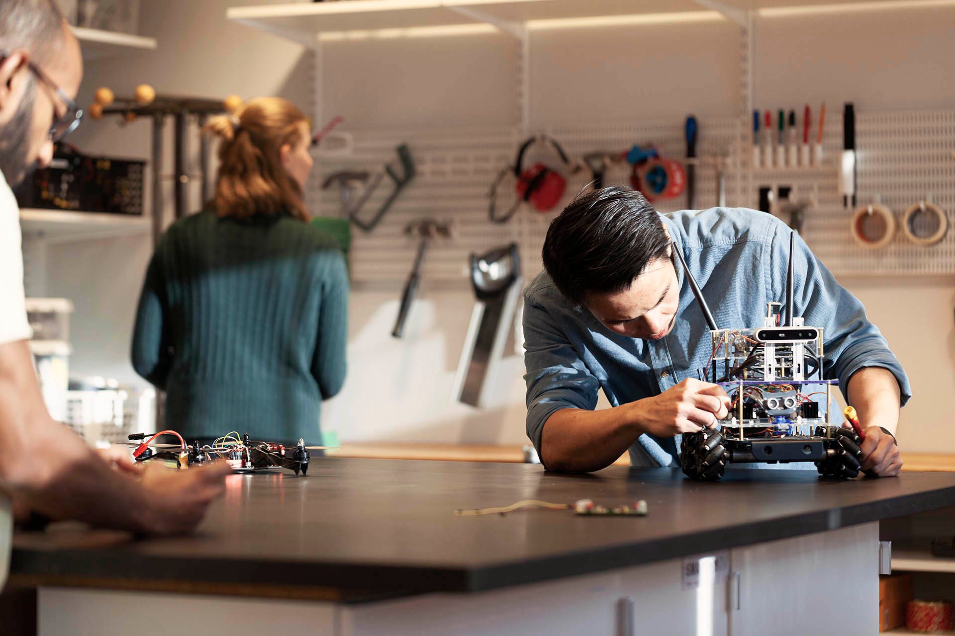 People in a workshop working on prototypes