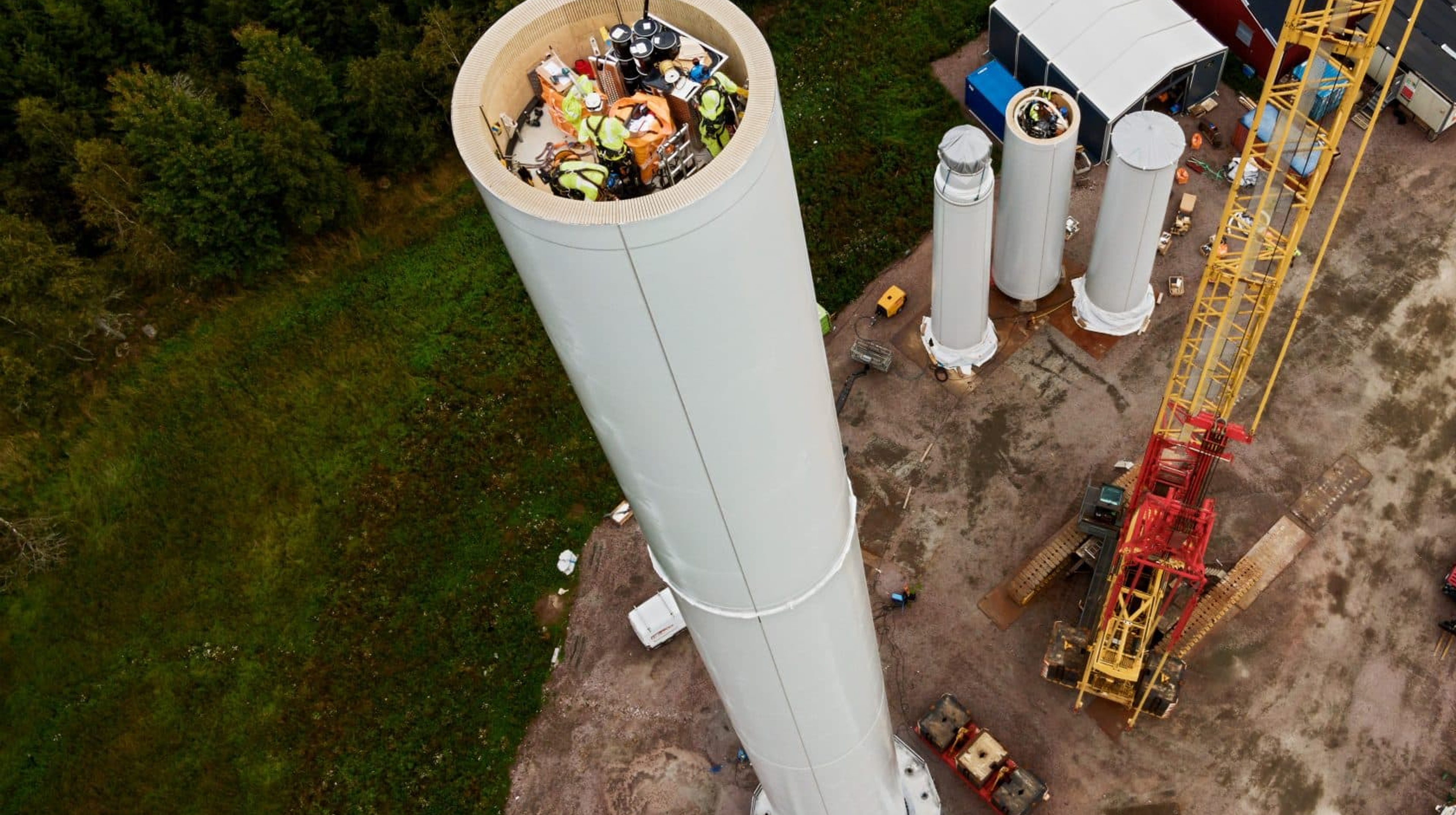 A wooden wind turbine under construction.