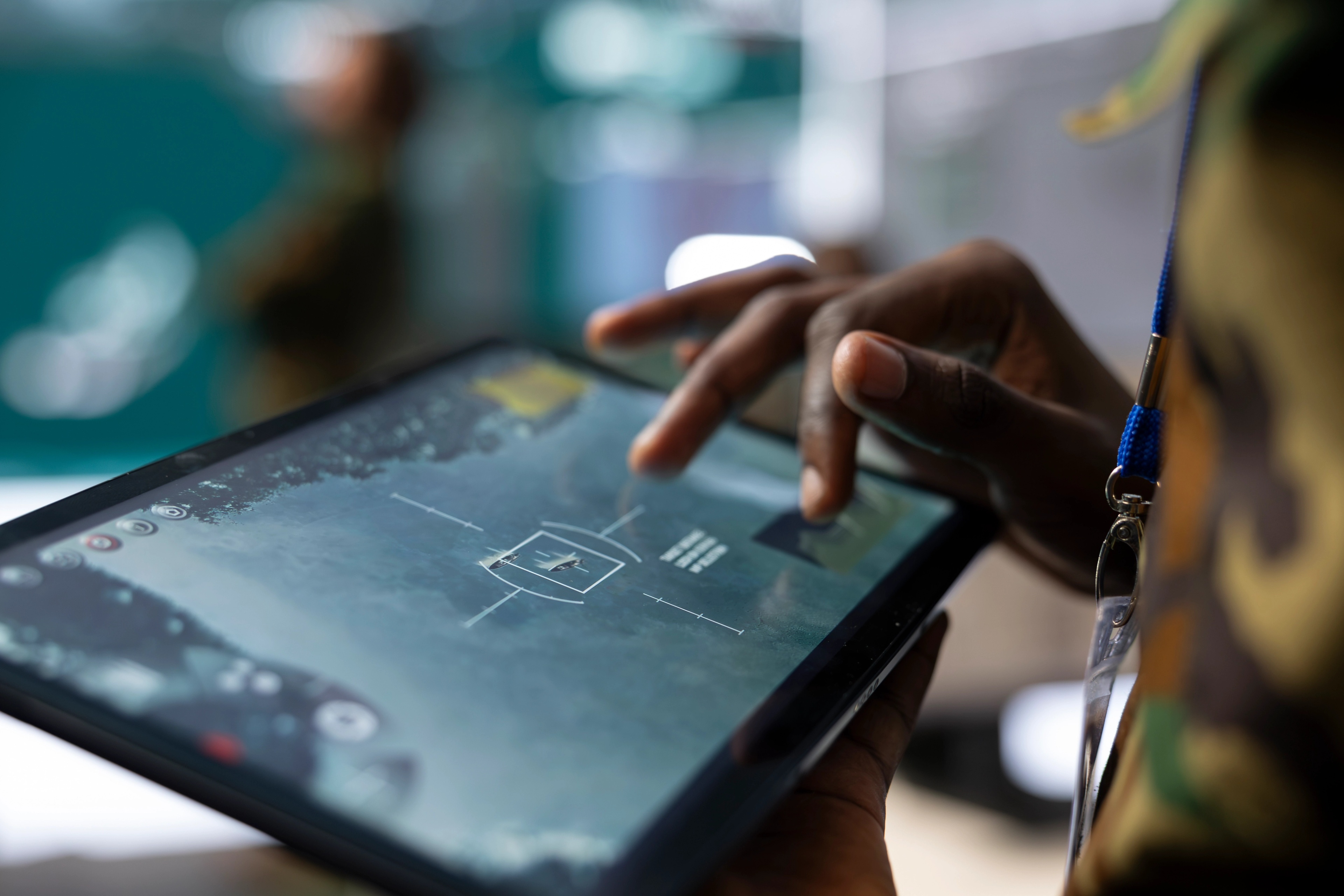 Finger pushing a touch screen