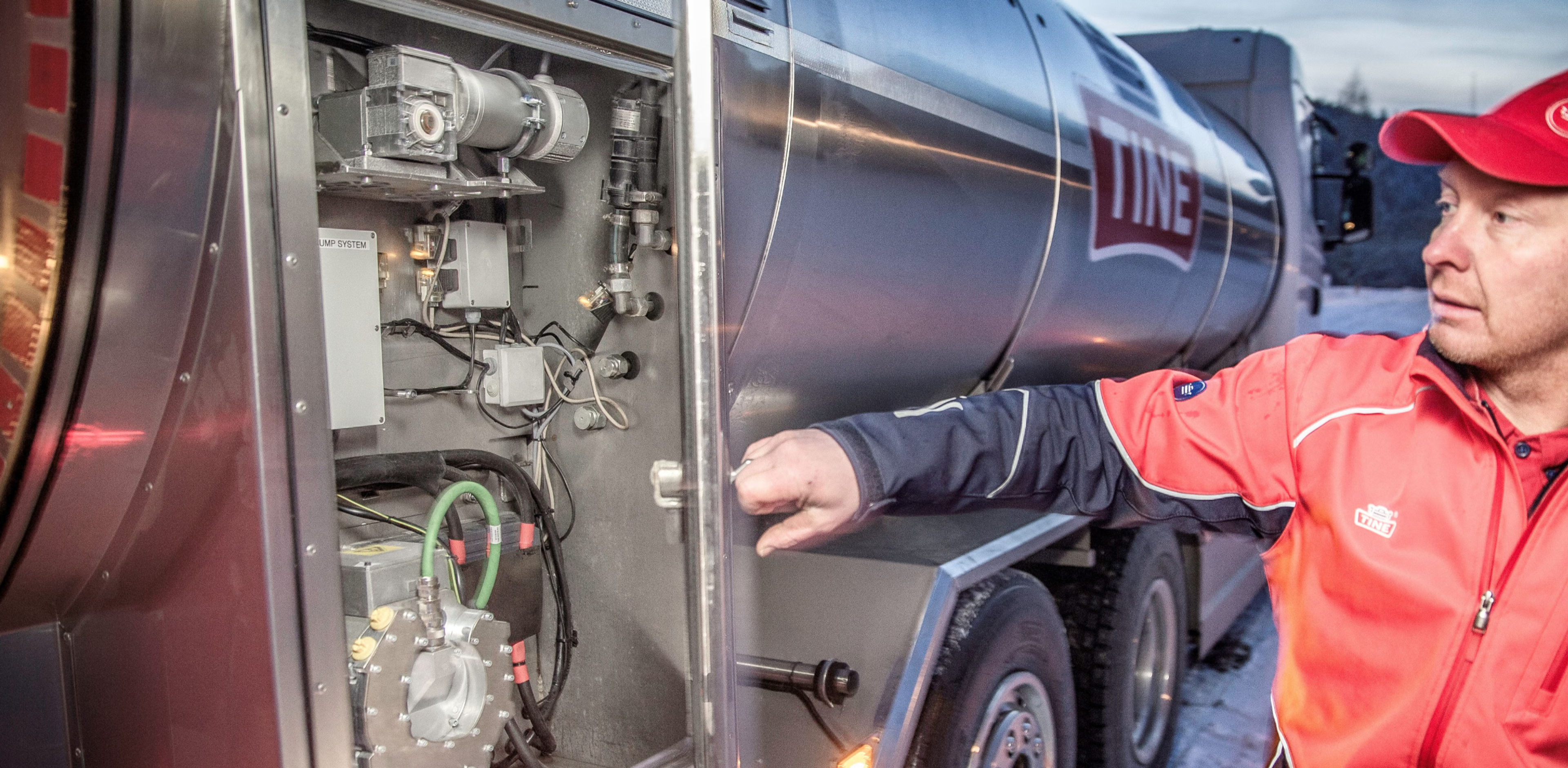 A closeup of the truck driver getting in to the electrified system