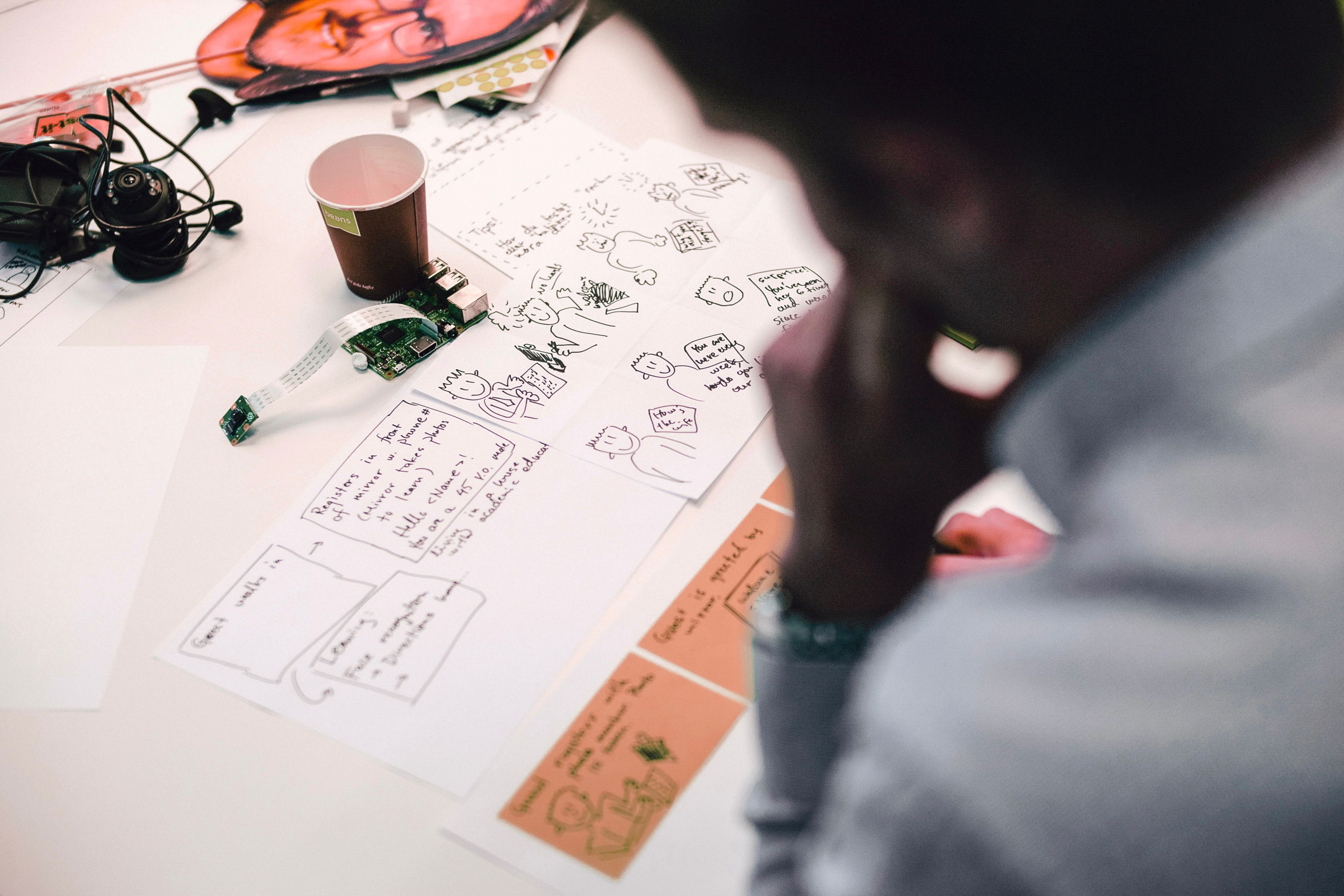 A person looking at design drawings