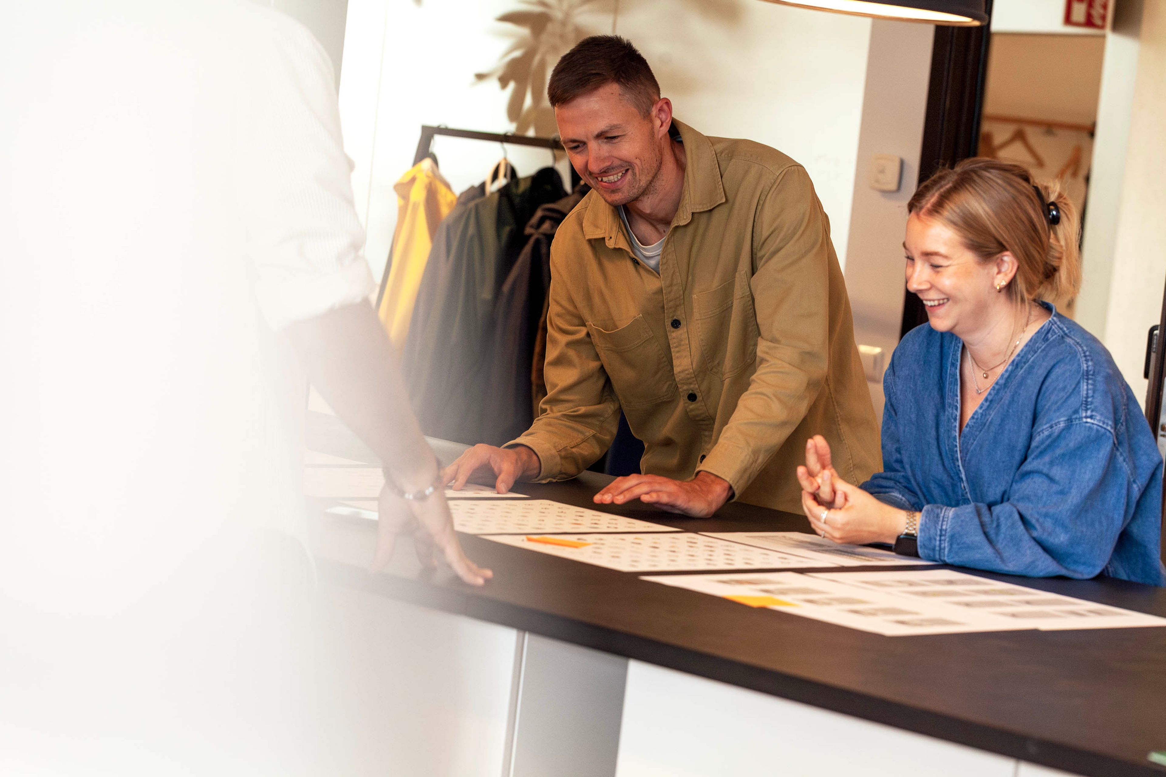 Two people discussing design material