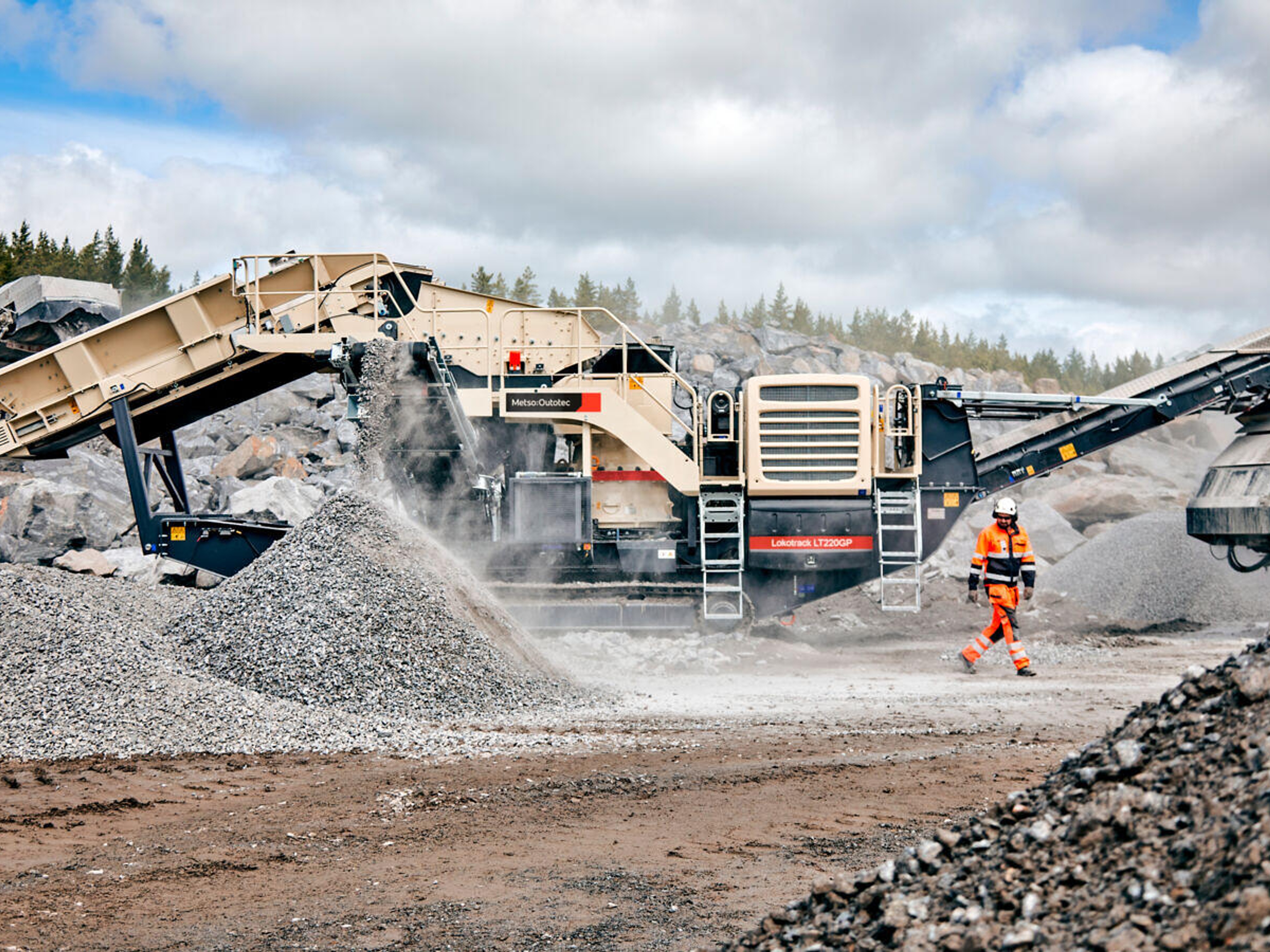 An outside mine with lots of different equipments and excavators