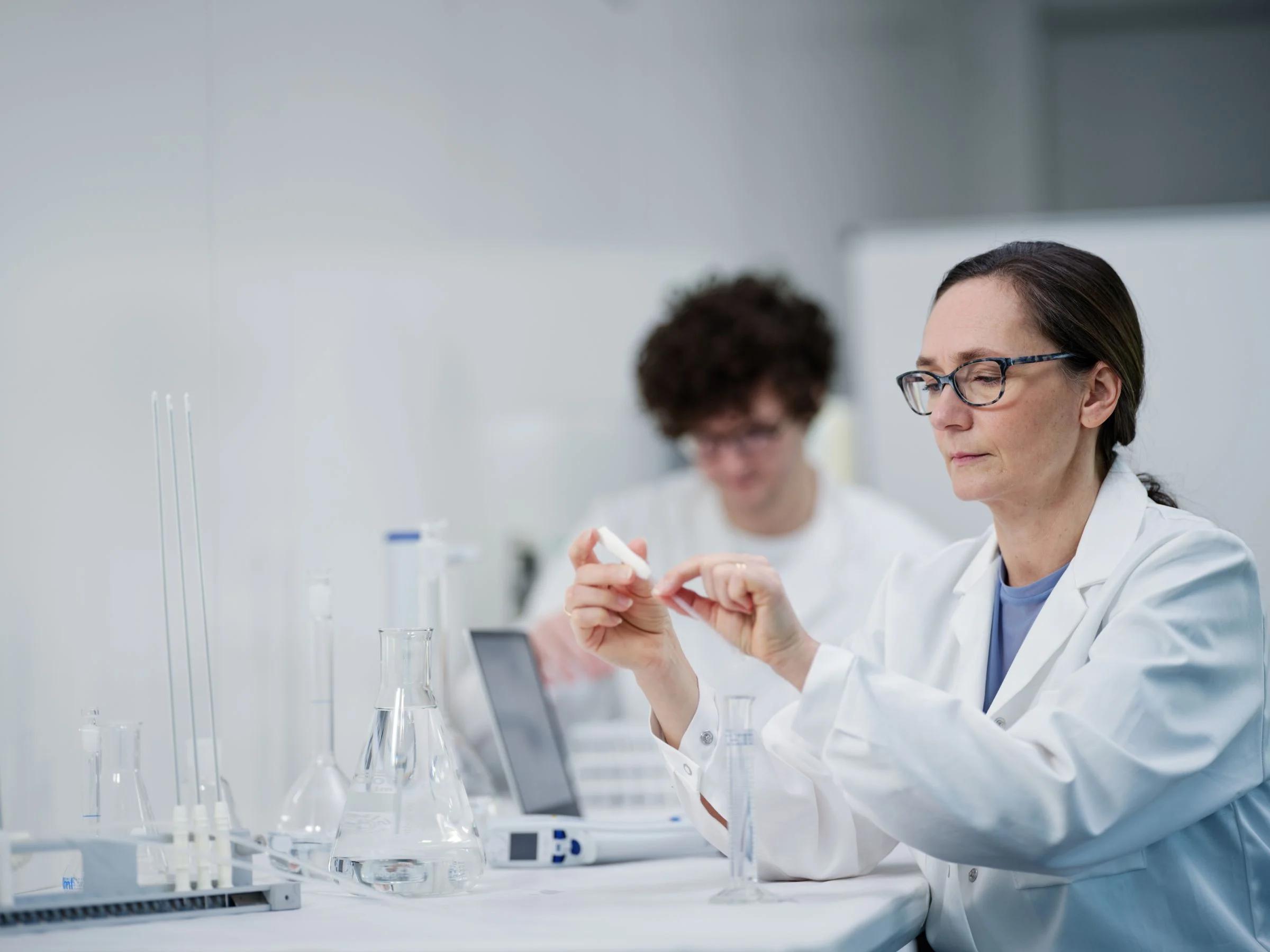 Images shows a scientist working in a lab