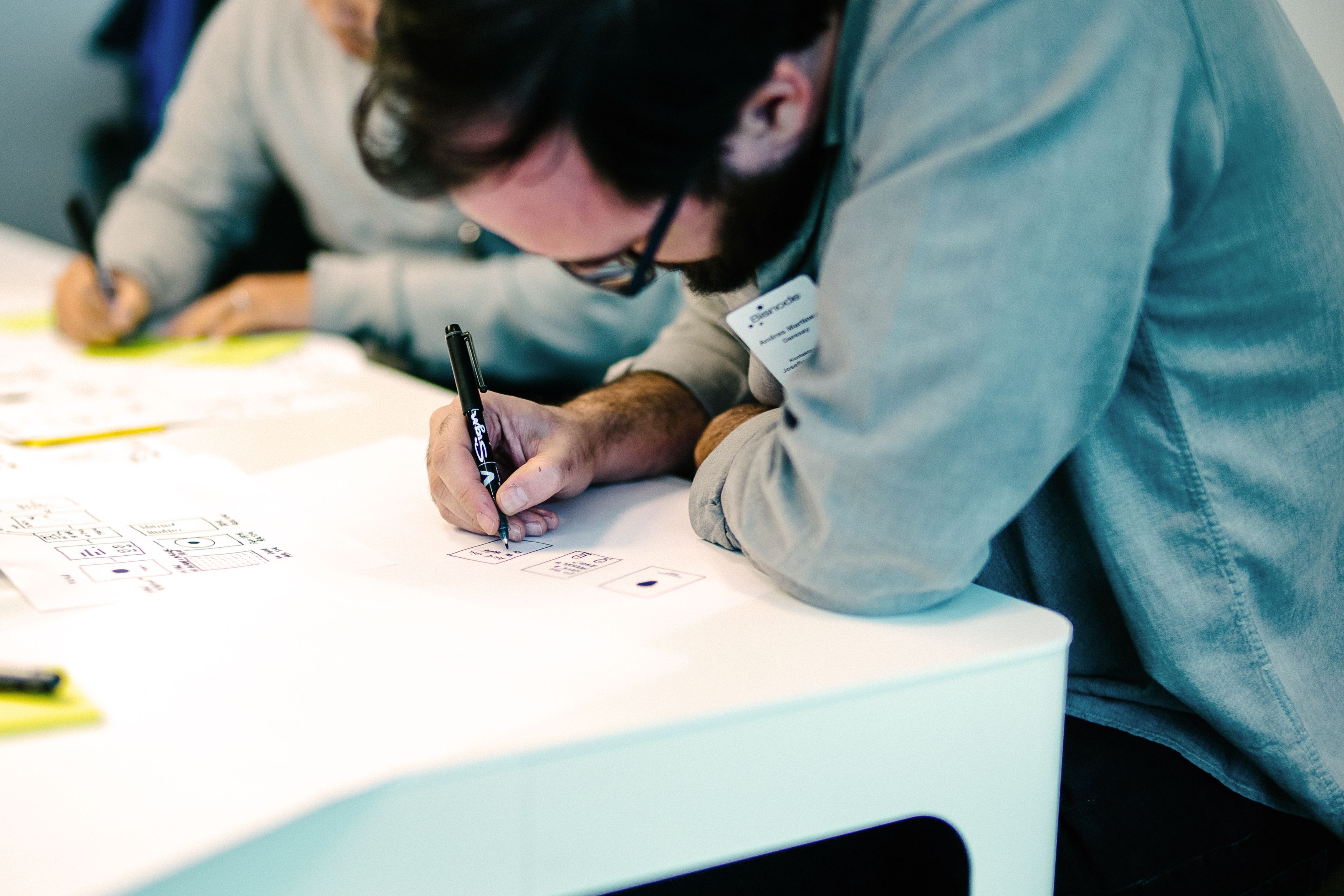 A man working on a design drawing
