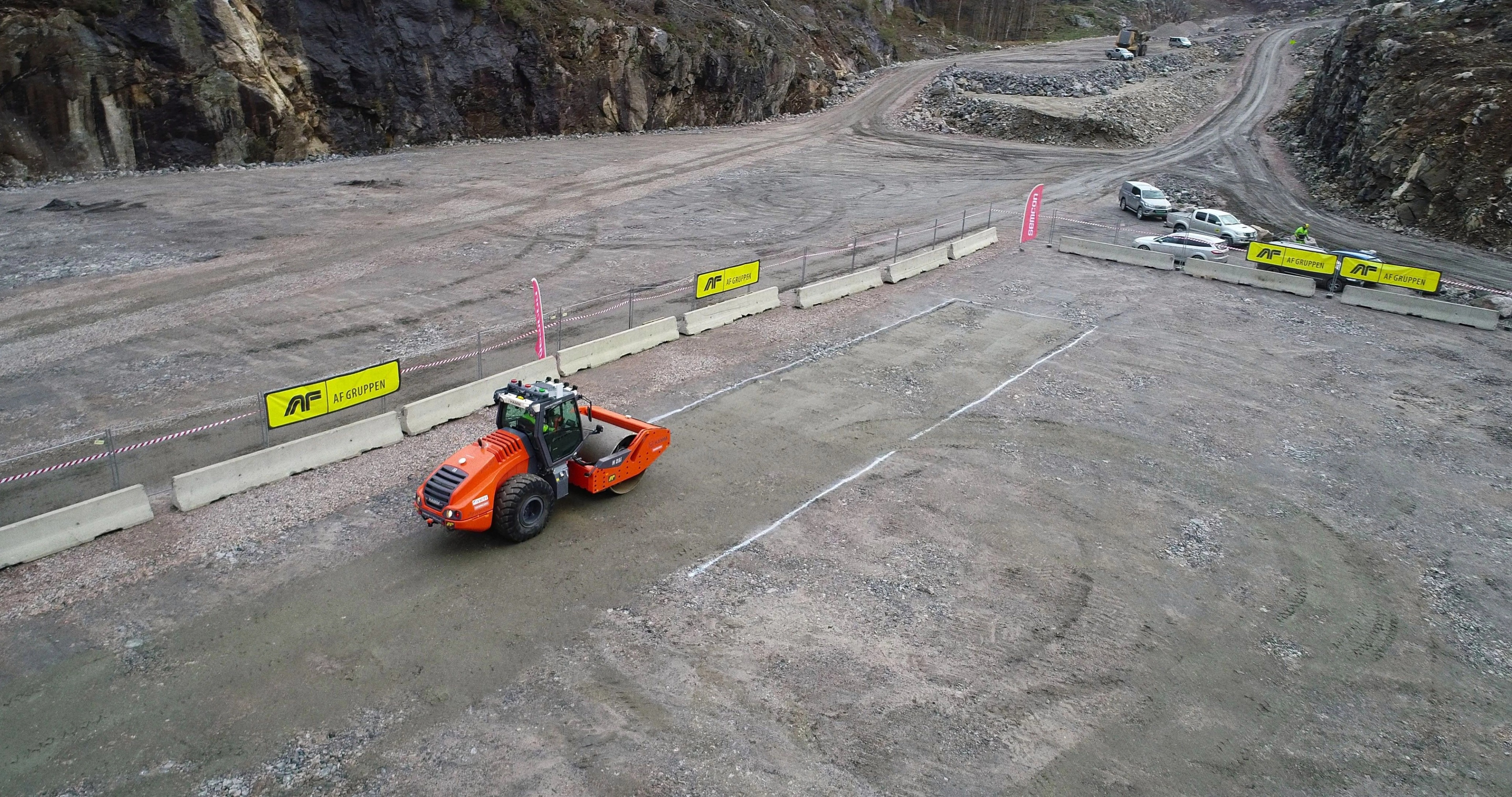 Heavy truck driving on a test track.