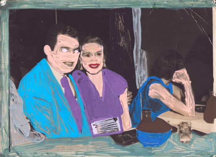 Blue, purple, and peach paint markers applied to a found photograph of a smiling couple sitting together in a restaurant or bar.