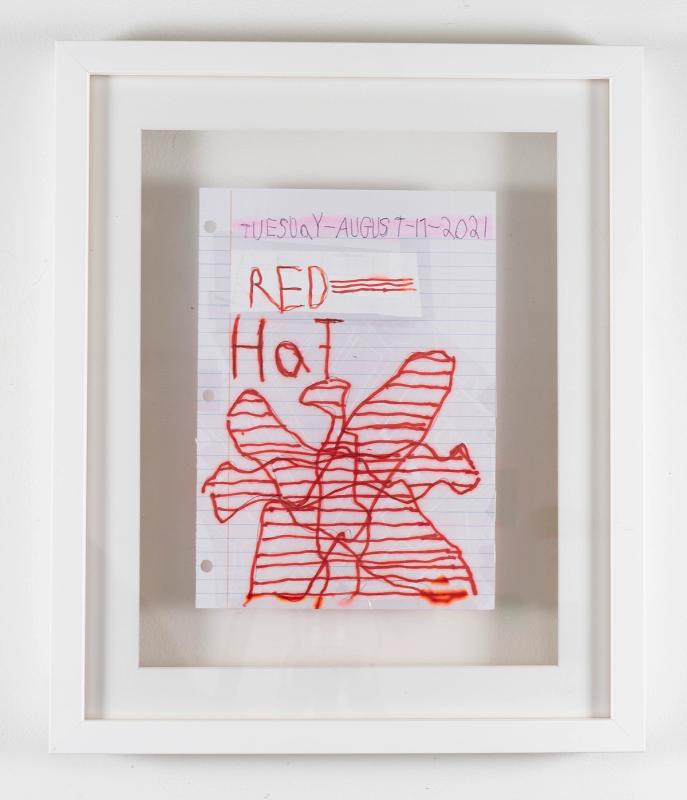 An 8 x 11 sheet of spiral notebook paper with blue, highlighted handwritten text at the top that reads, "Tuesday-August-17-2021." Below it is bold, red handwritten text and an abstract line drawing that reads, "RED HAT."