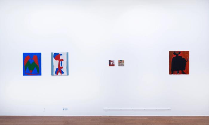 Five paintings hanging on a white gallery wall. from left to right, one, two, and five are the same medium size, and the third and fourth are very small. all are colorful and mostly abstract.