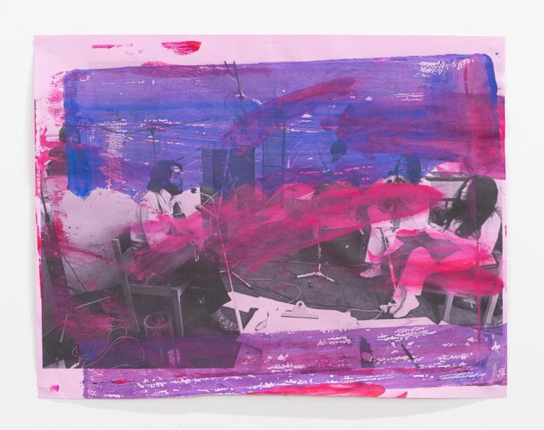 Pink, purple, and blue paint applied to a photograph of Paul McCartney, John Lennon, and Yoko Ono sitting together in a recording studio, facing one another.