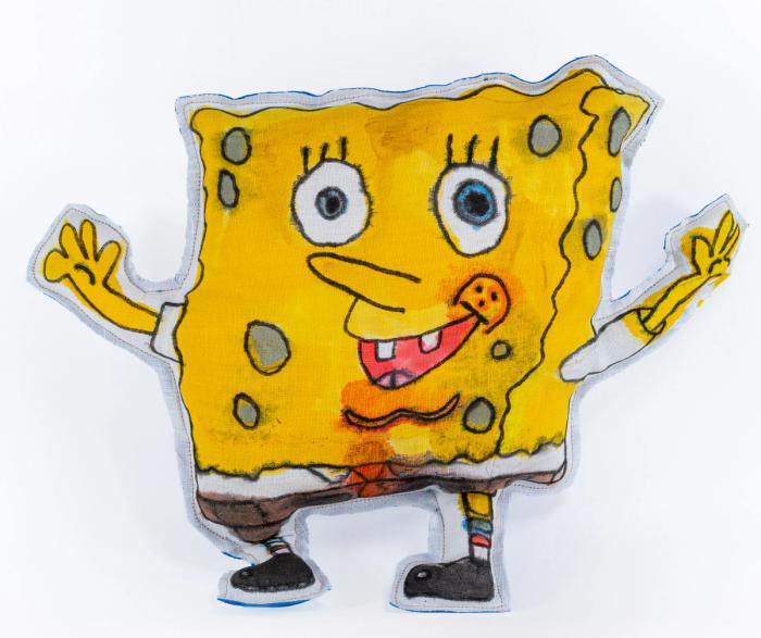 Cartoon sponge character with a happy expression on a white background