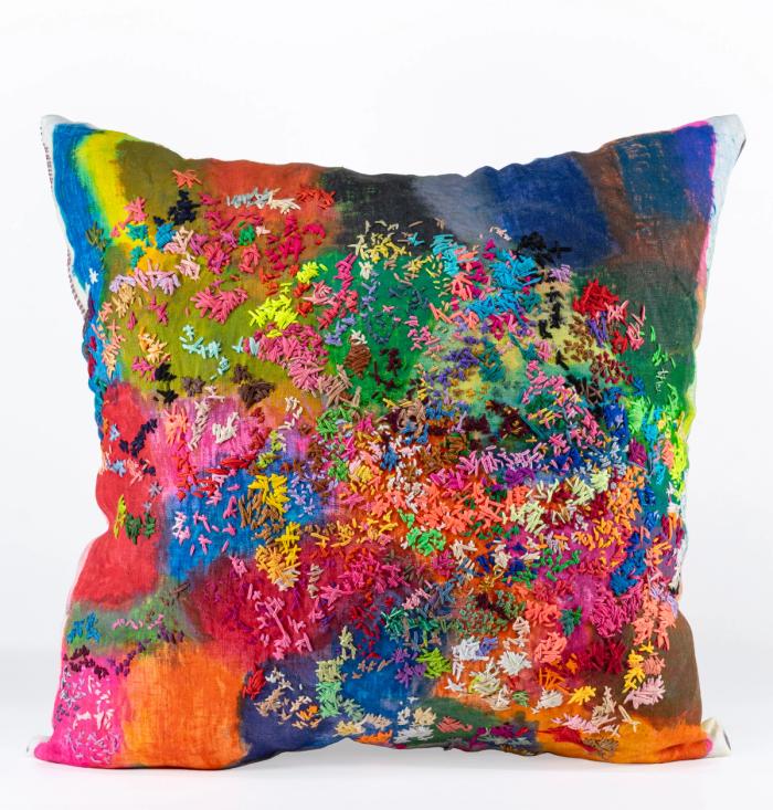 Colorful pillow with a floral pattern on a white background