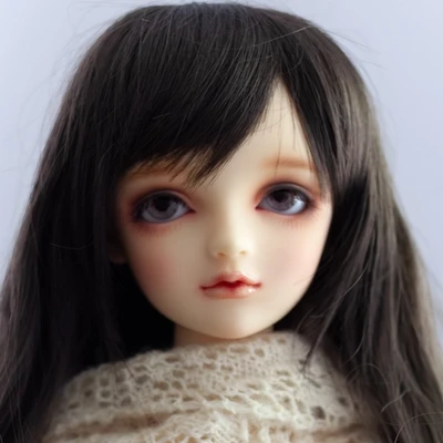 Female ball-jointed resin doll with long black hair, purple eyes, wearing an off-white lace shawl.