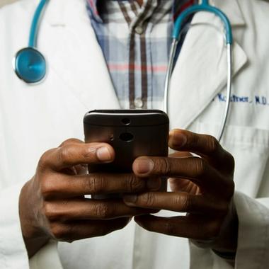 healthcare professional using phone or app healthcare professional using phone or app
