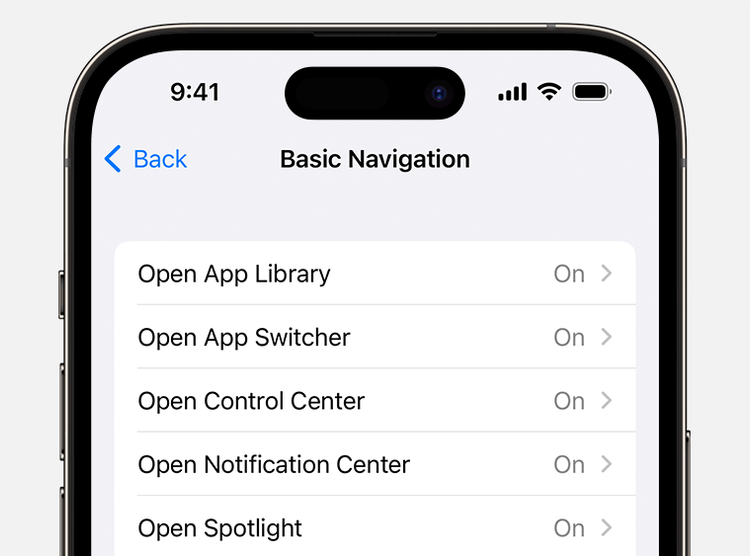 Close-up of an iPhone screen showing the 'Basic Navigation' settings menu with options like 'Open App Library,' 'Open App Switcher,' 'Open Control Center,' 'Open Notification Center,' and 'Open Spotlight,' all toggled to 'On.'