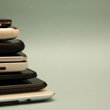 stack of different phones stack of different phones