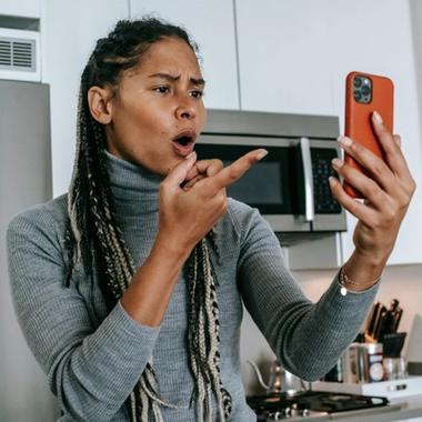 women frustrated at something on her phone women frustrated at something on her phone