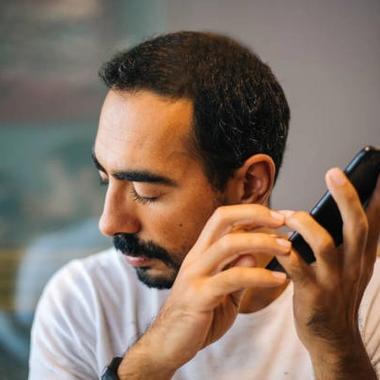 Man with disability using phone and apps Man with disability using phone and apps