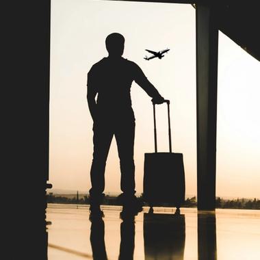 travelling man with suitcase at the airport travelling man with suitcase at the airport