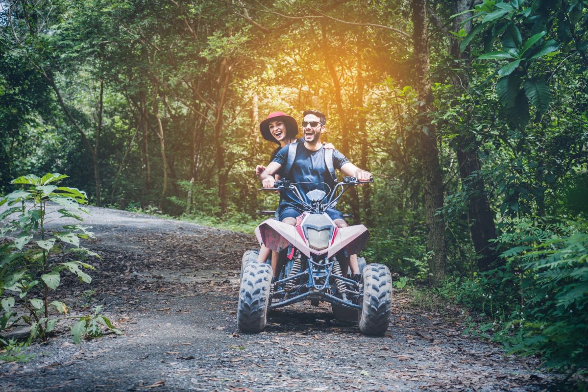 Couple riding a UTV together.