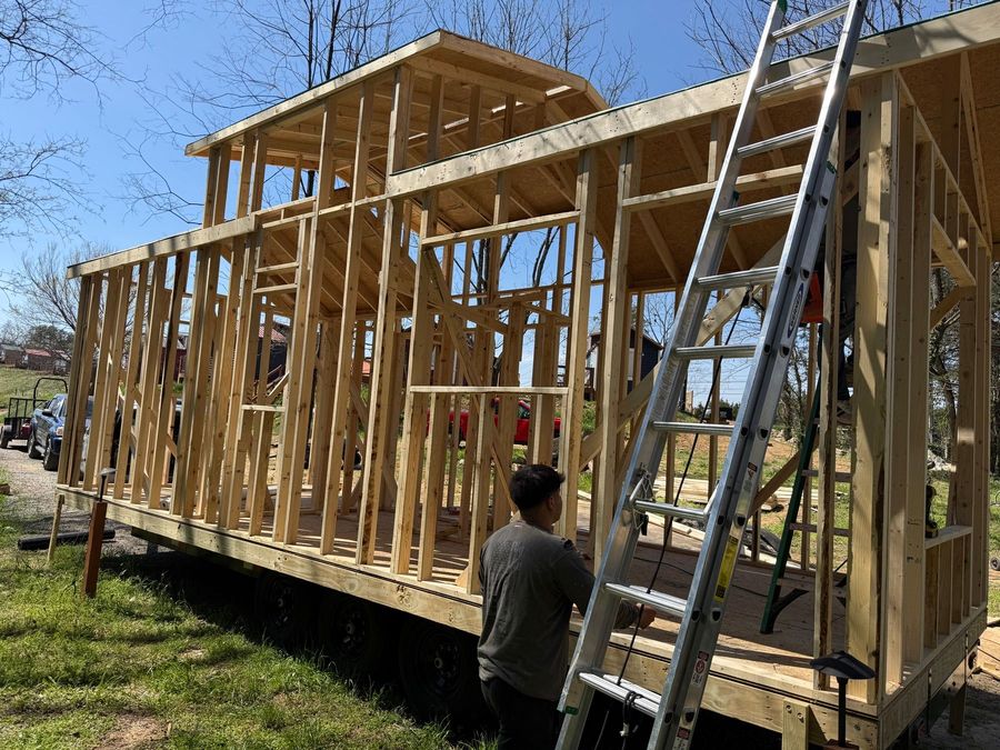 Tiny home being moved into position during Sojourn construction