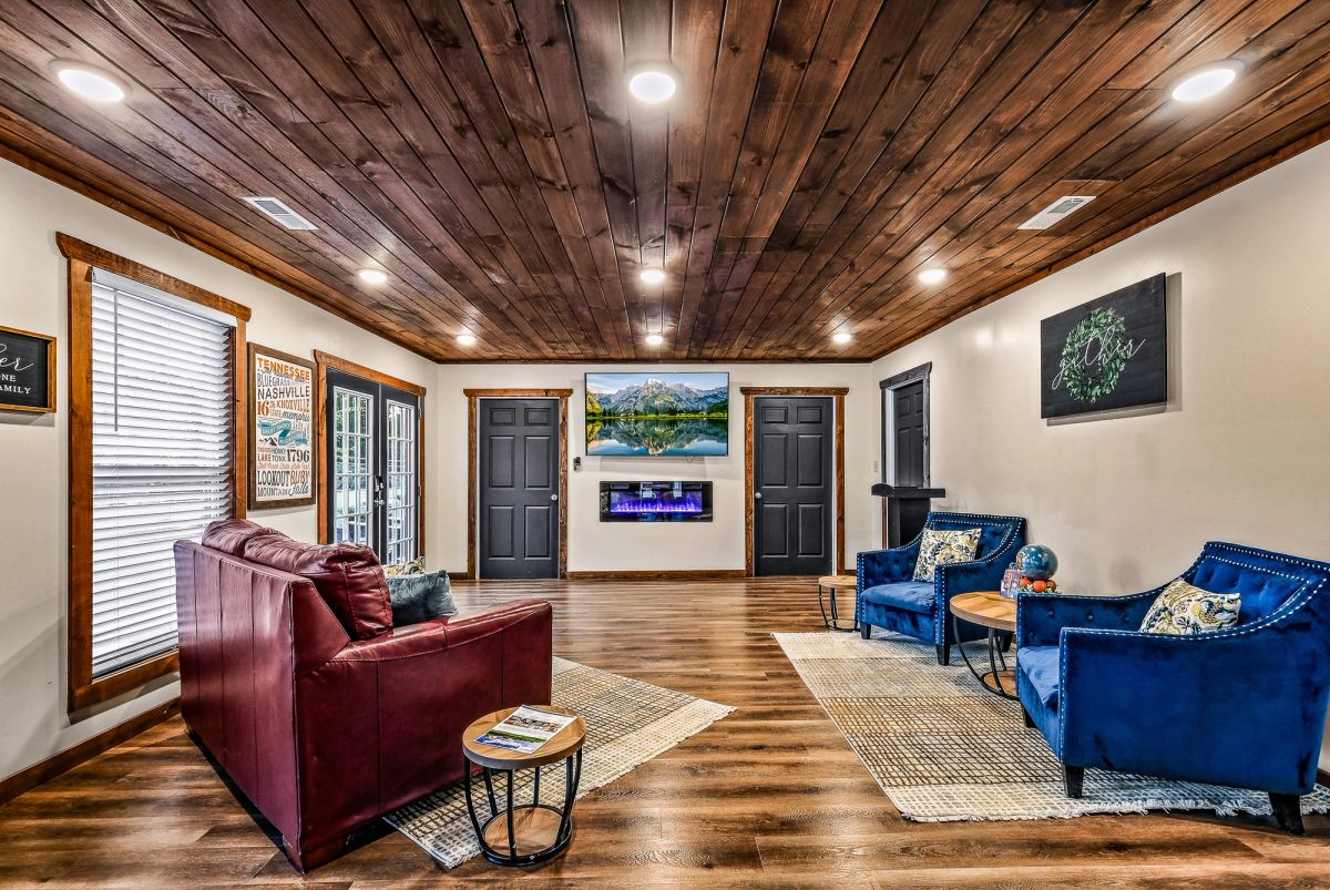 Sojourn Lodging Welcome Center lounge with fireplace and comfortable seating for community gatherings