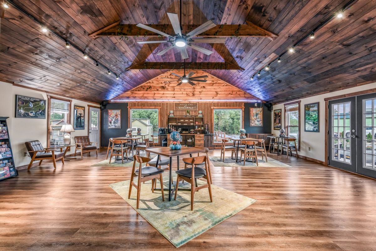 Interior of Sojourn Lodging Welcome Center community hall with warm wood accents
