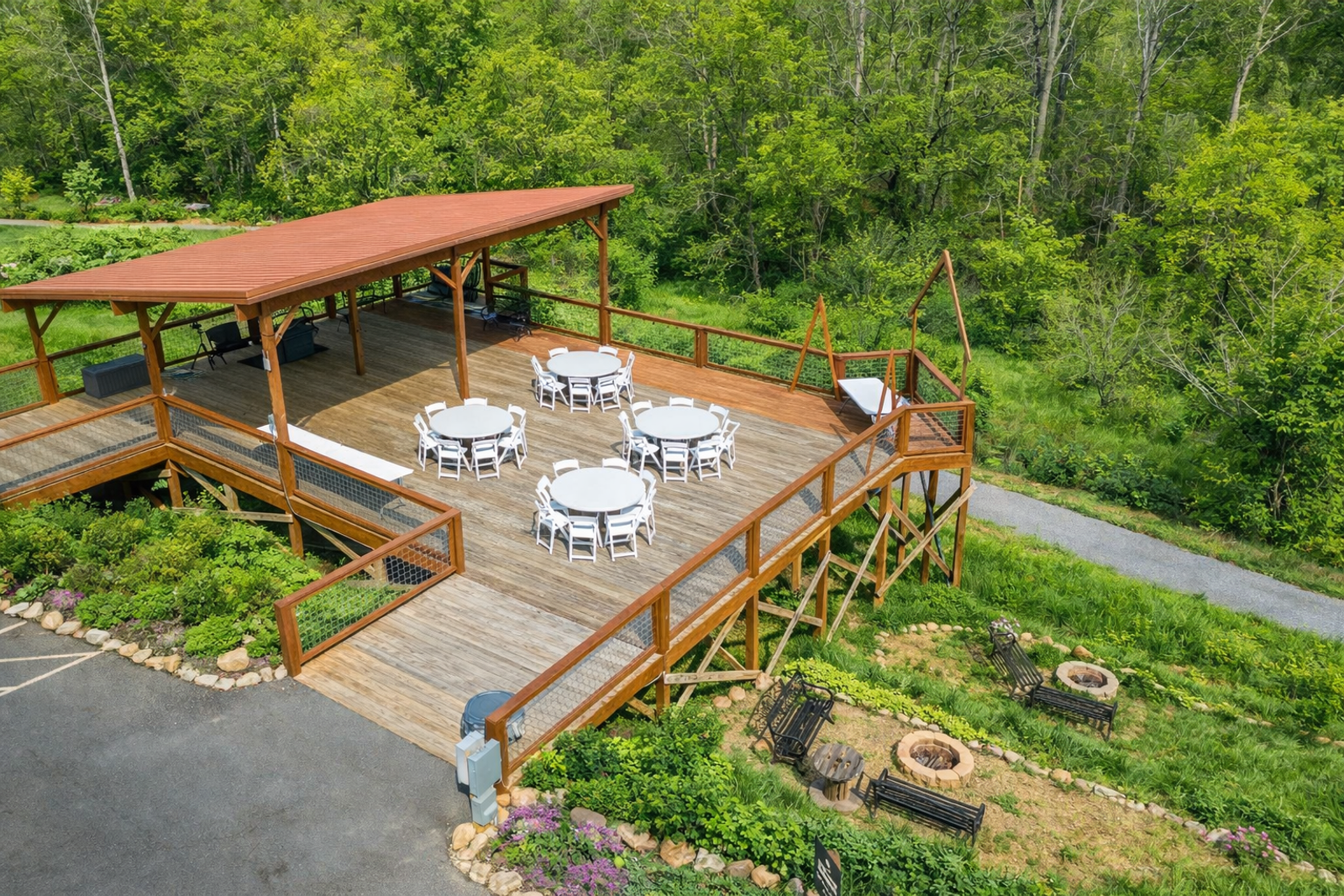 Aerial view of the Observation Deck at Sojourn Lodging set with round tables and chairs for a group gathering