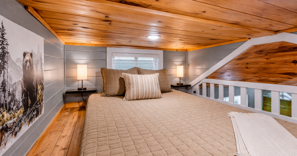 Cozy loft bedroom inside The Evergreen at Sojourn Lodging