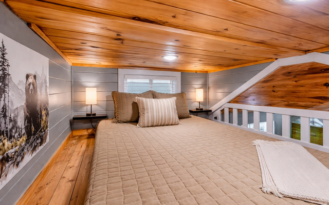 Cozy loft bedroom inside The Evergreen at Sojourn Lodging