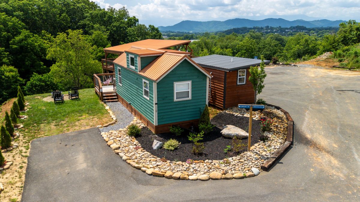 Aerial view of Sojourn tiny home surrounded by lush landscaping with Smoky Mountain views
