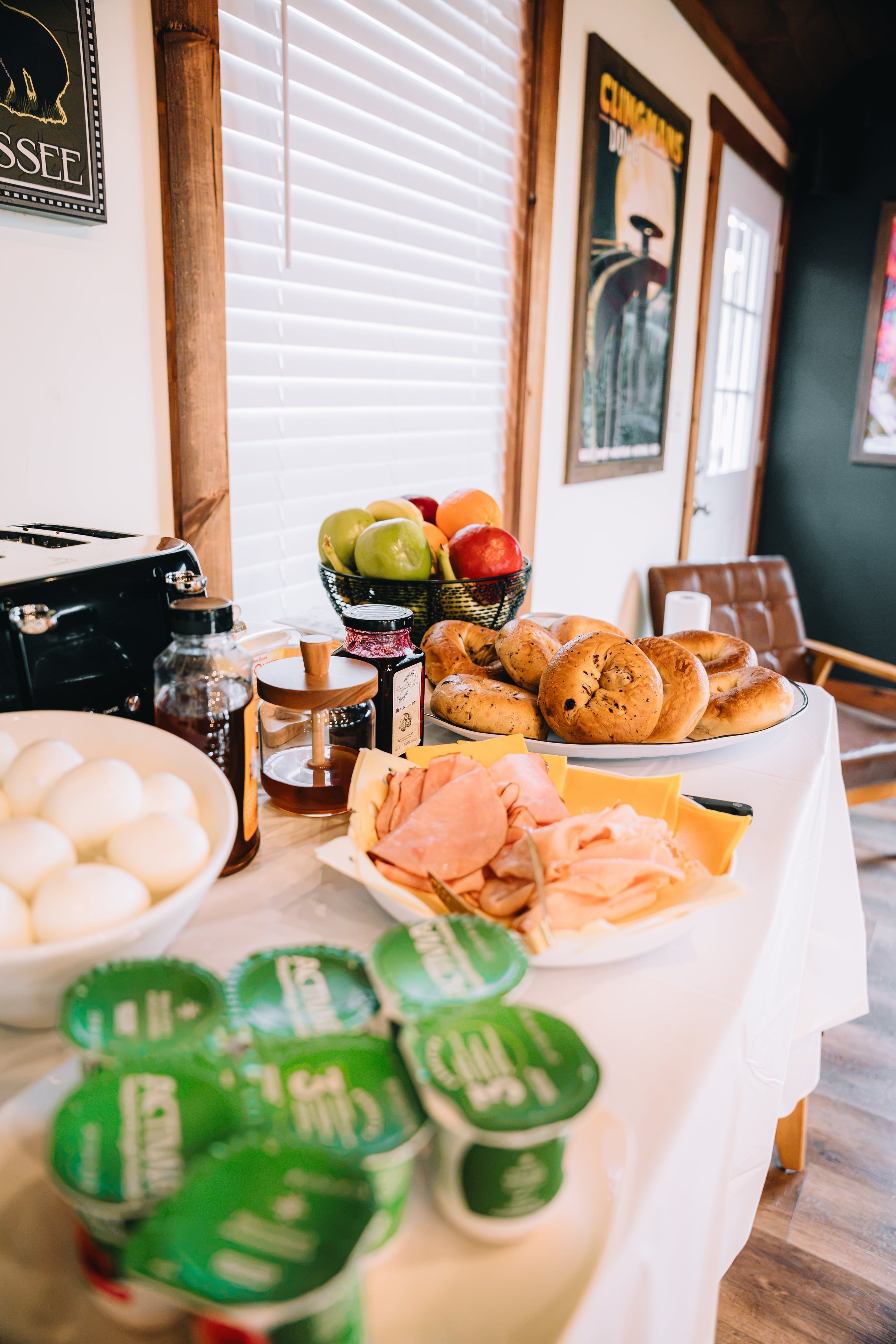 Pastries, fresh fruit and yogurt on the Welcome Center breakfast table at Sojourn Lodging