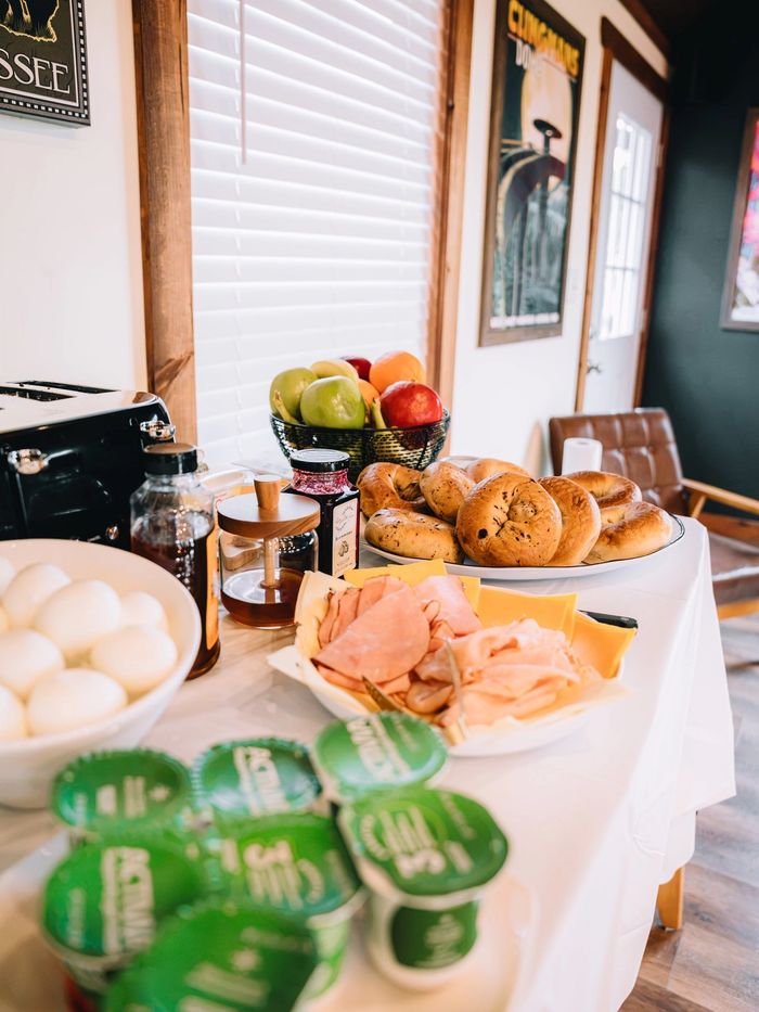 Pastries, fresh fruit and yogurt on the Welcome Center breakfast table at Sojourn Lodging