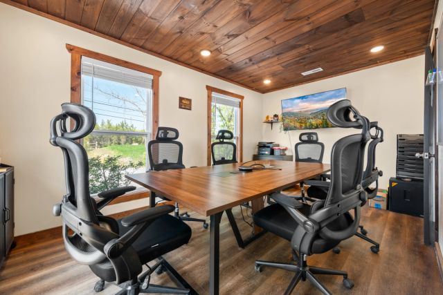 Private meeting room with conference table and chairs at Sojourn Lodging Welcome Center